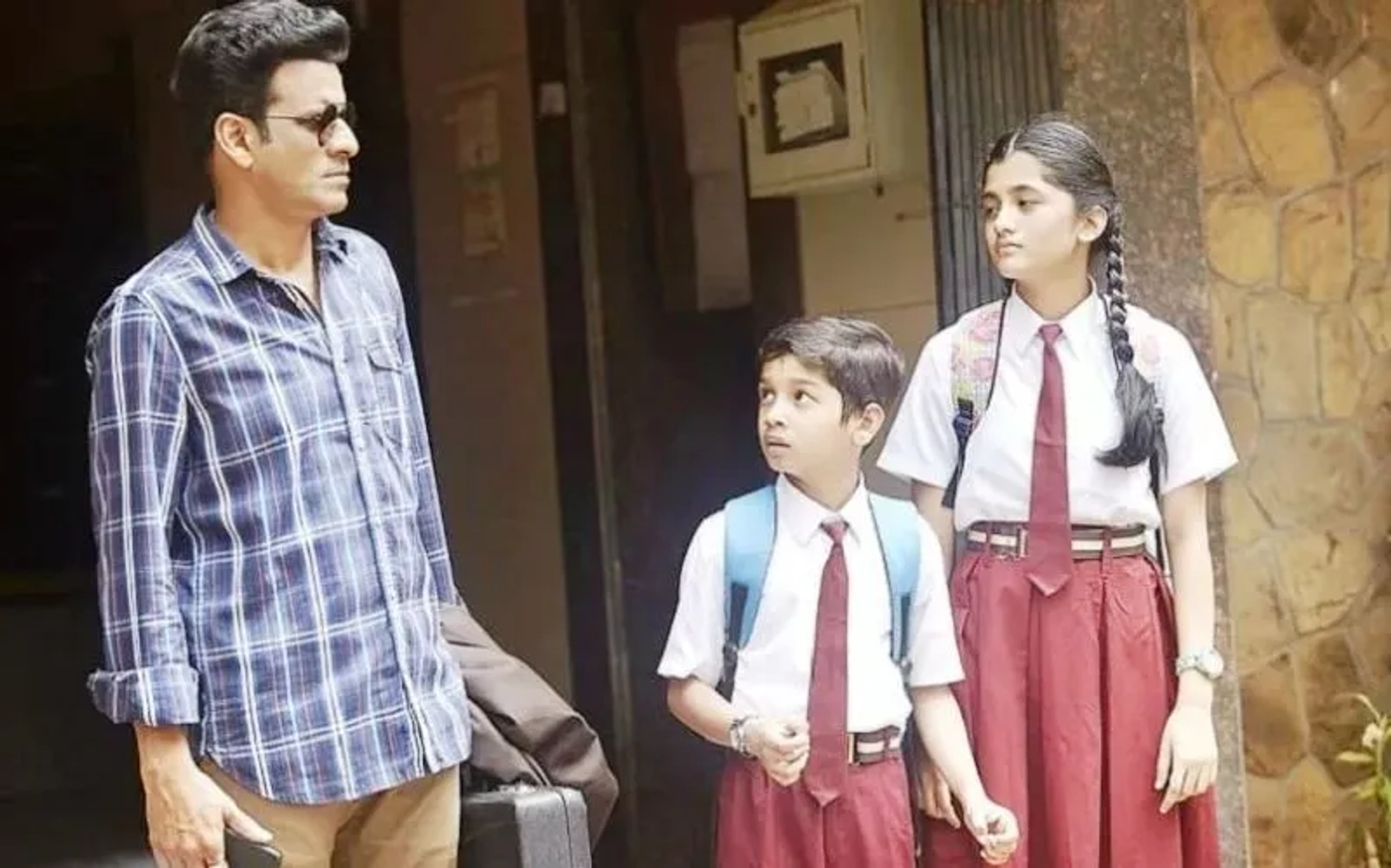 Manoj Bajpayee, Ashlesha Thakur, and Vedant Sinha in The Family Man (2019)