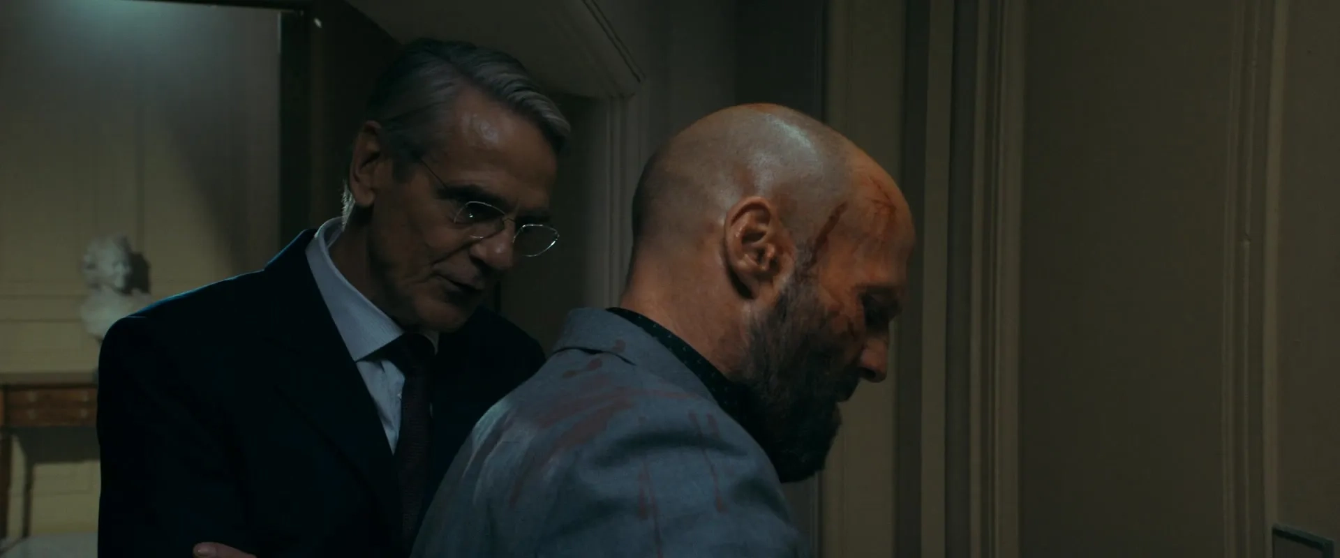 Jeremy Irons and Jason Statham in The Beekeeper (2024)