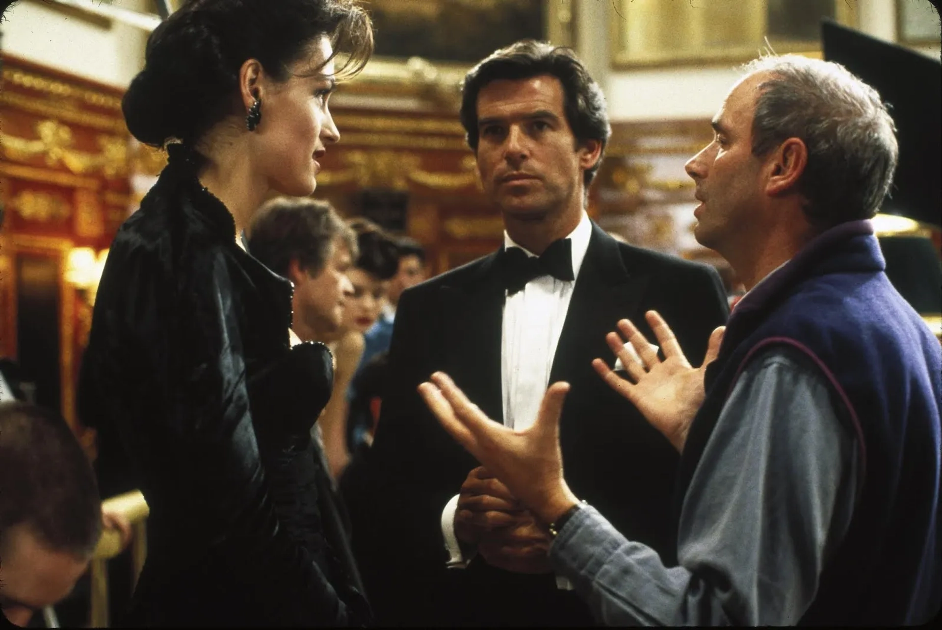 Pierce Brosnan, Izabella Scorupco, and Martin Campbell in GoldenEye (1995)