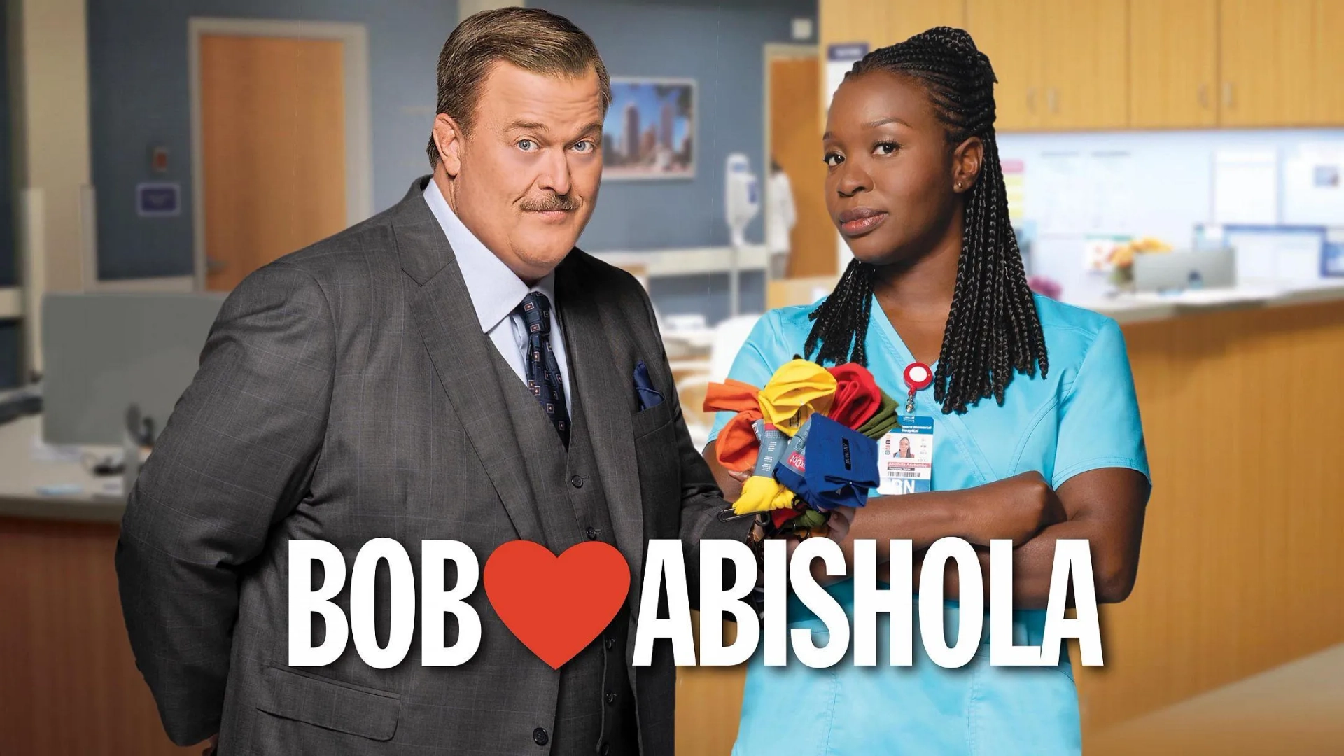 Billy Gardell and Folake Olowofoyeku in Bob Hearts Abishola (2019)