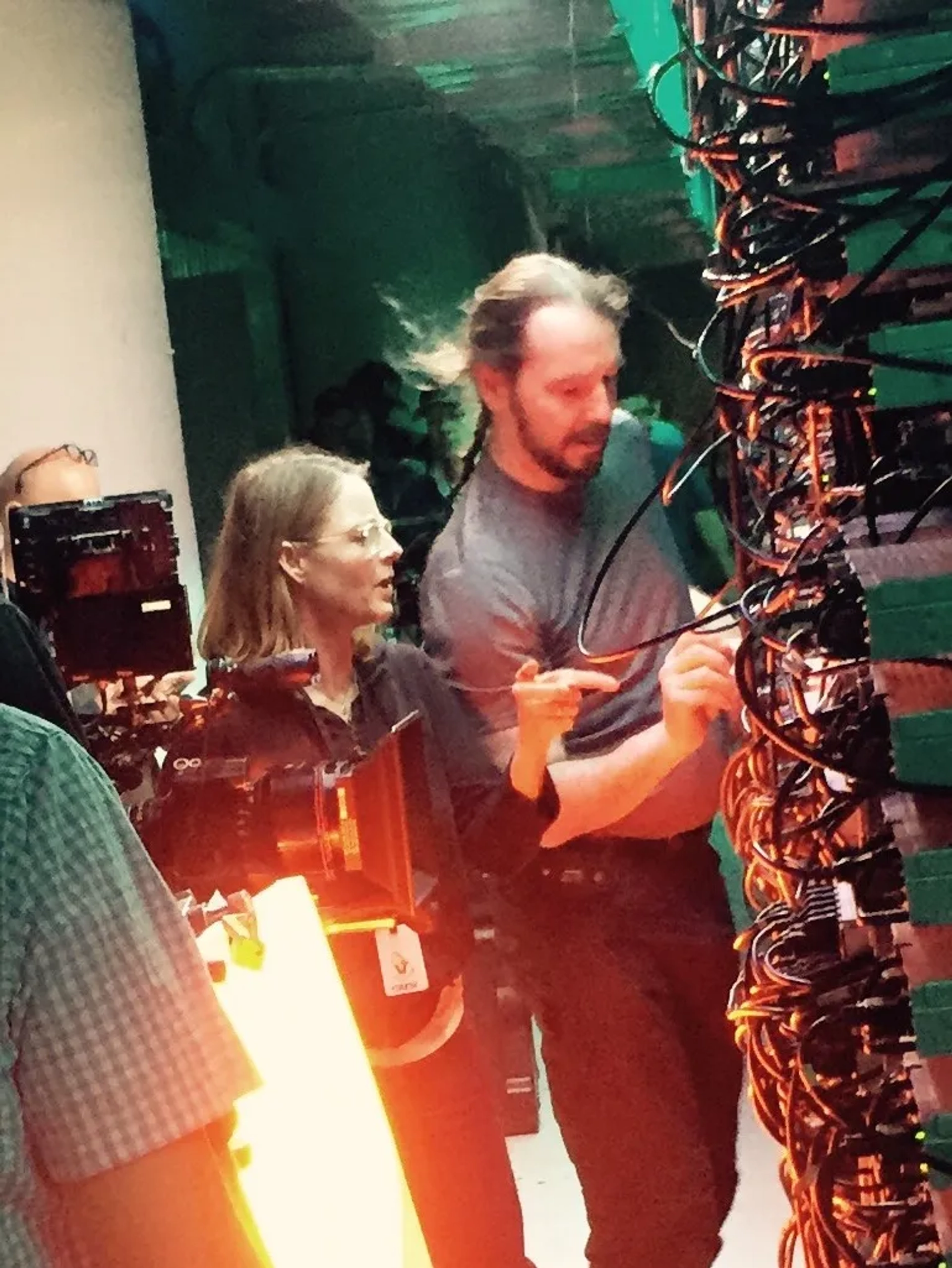 Jodie Foster and Mark Cyr dressing technology on the set of Money Monster