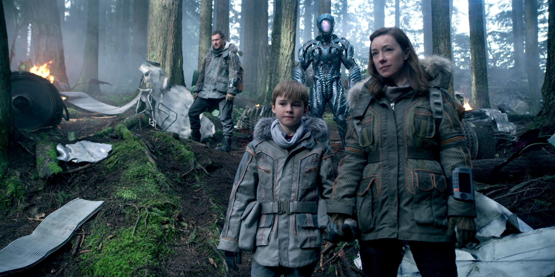 Molly Parker, Brian Steele, Toby Stephens, and Maxwell Jenkins in Lost in Space (2018)