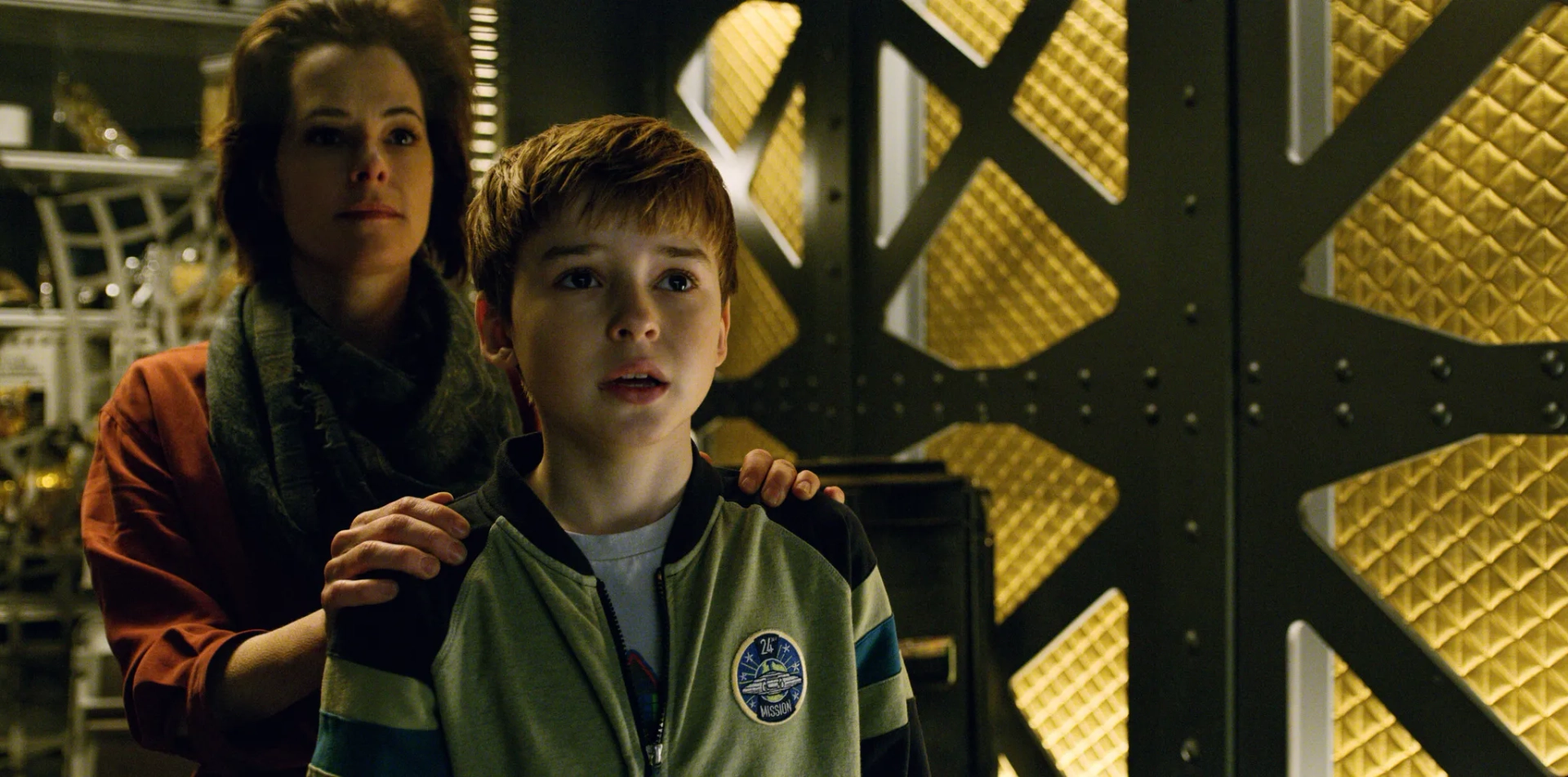 Parker Posey and Maxwell Jenkins in Lost in Space (2018)