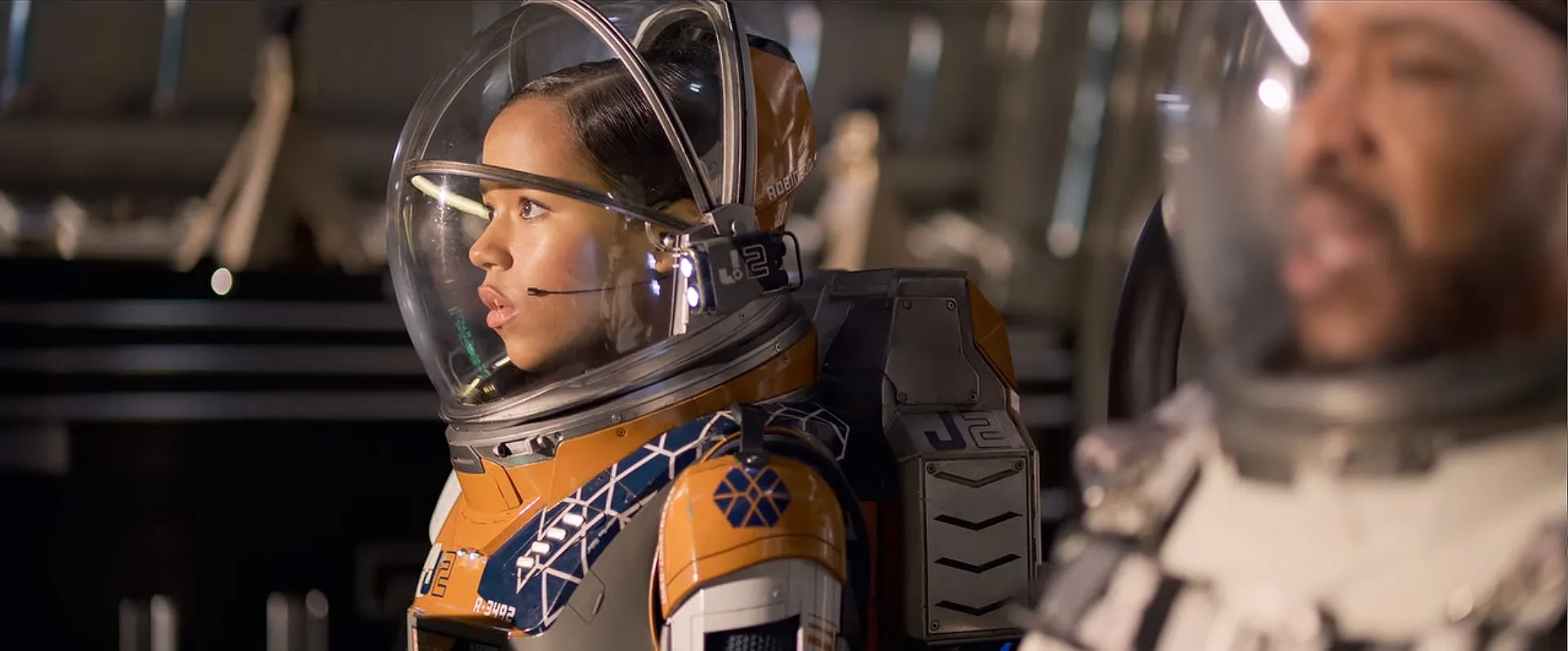 Russell Hornsby and Taylor Russell in Lost in Space: Contact (2021)