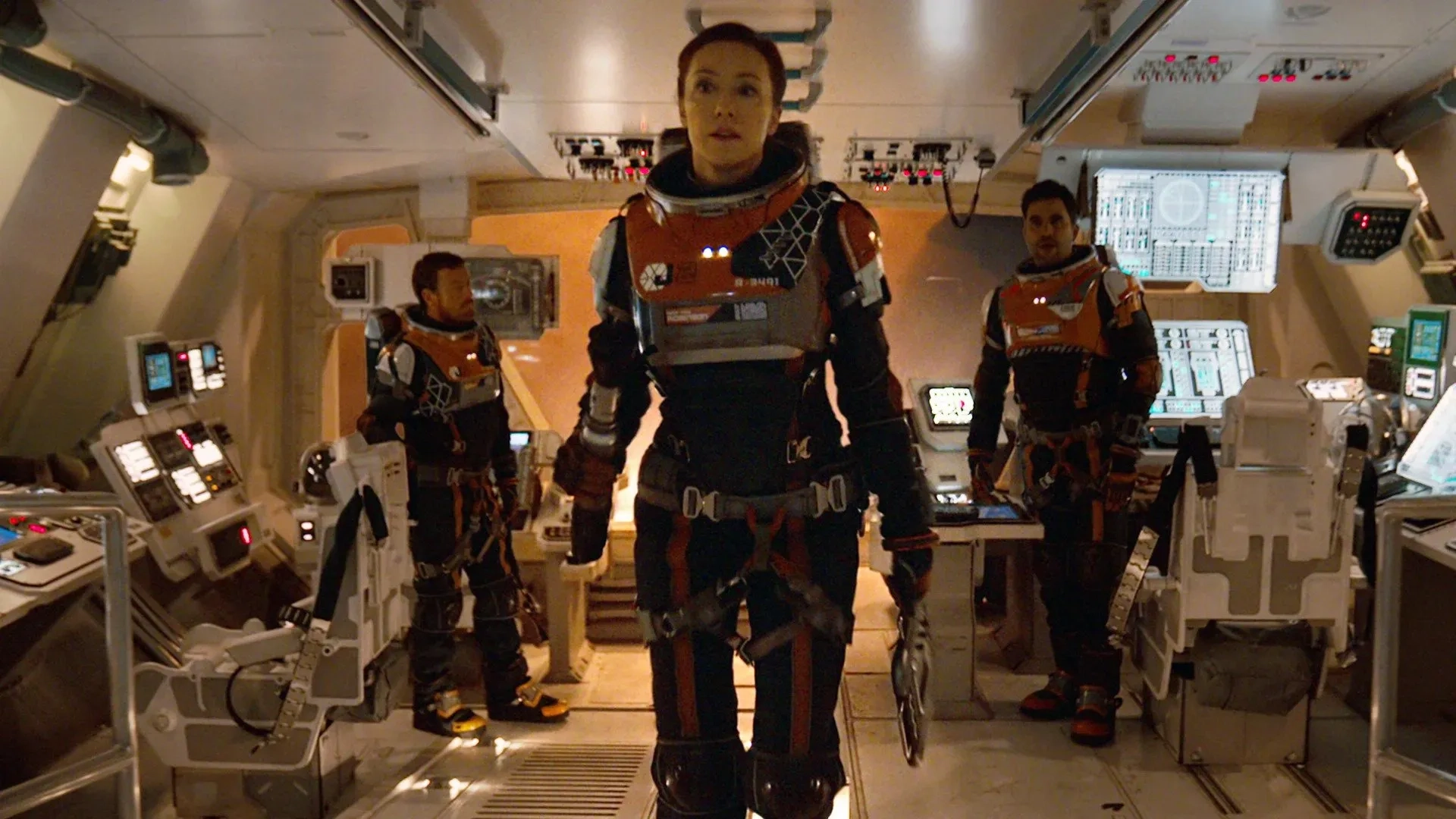 Molly Parker, Toby Stephens, and Ignacio Serricchio in Lost in Space: Contact (2021)