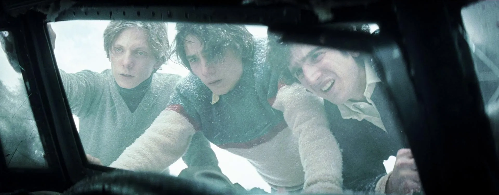 Enzo Vogrincic, Tomas Wolf, and Francisco Romero in Society of the Snow (2023)