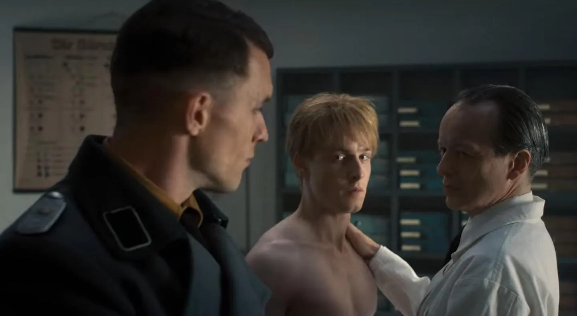 As Dr. Heinrich in ATLWCS (with Louis Hofmann & Ed Skrein)