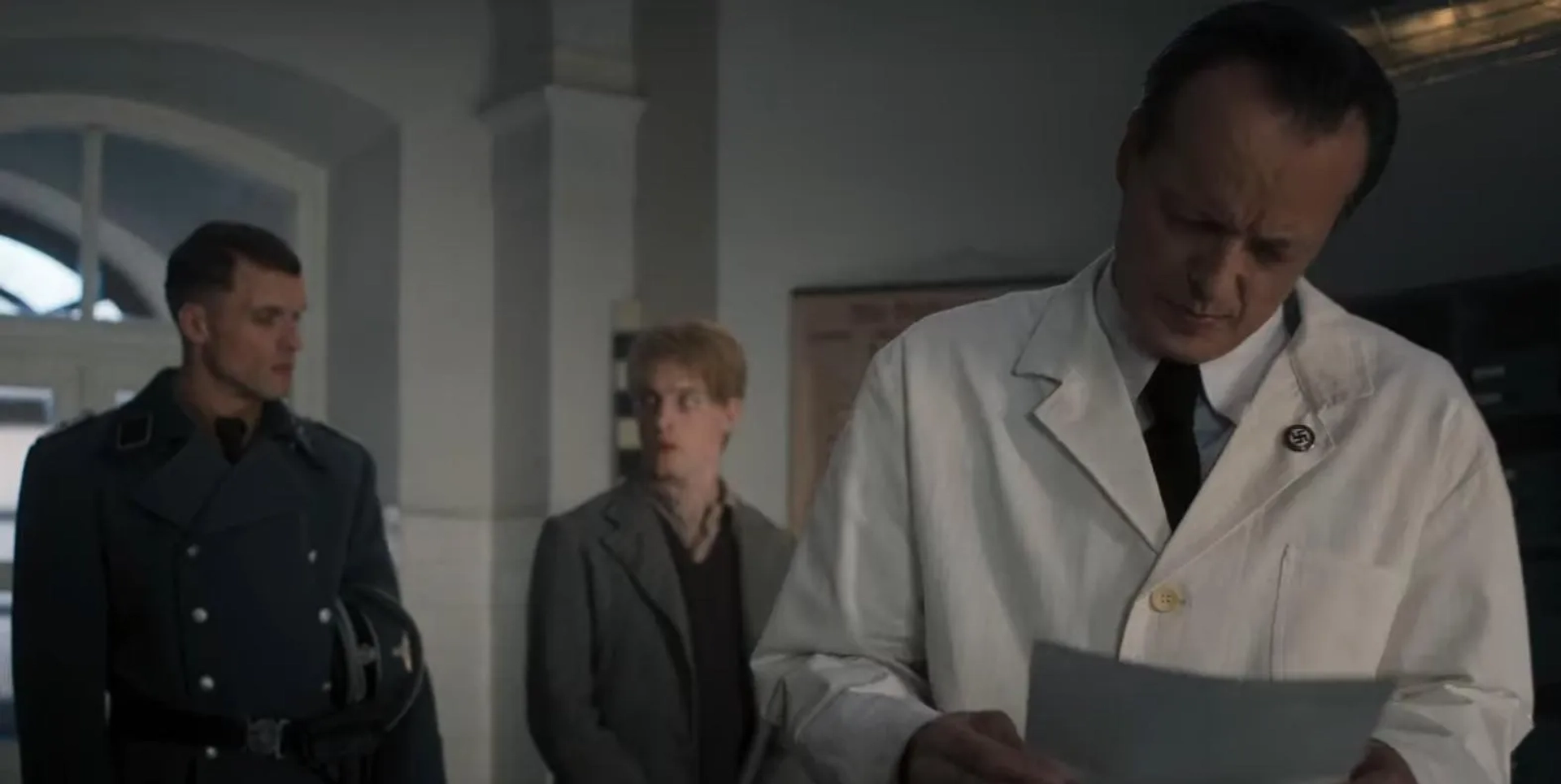 As Dr. Heinrich in ATLWCS (with Louis Hofmann & Ed Skrein)