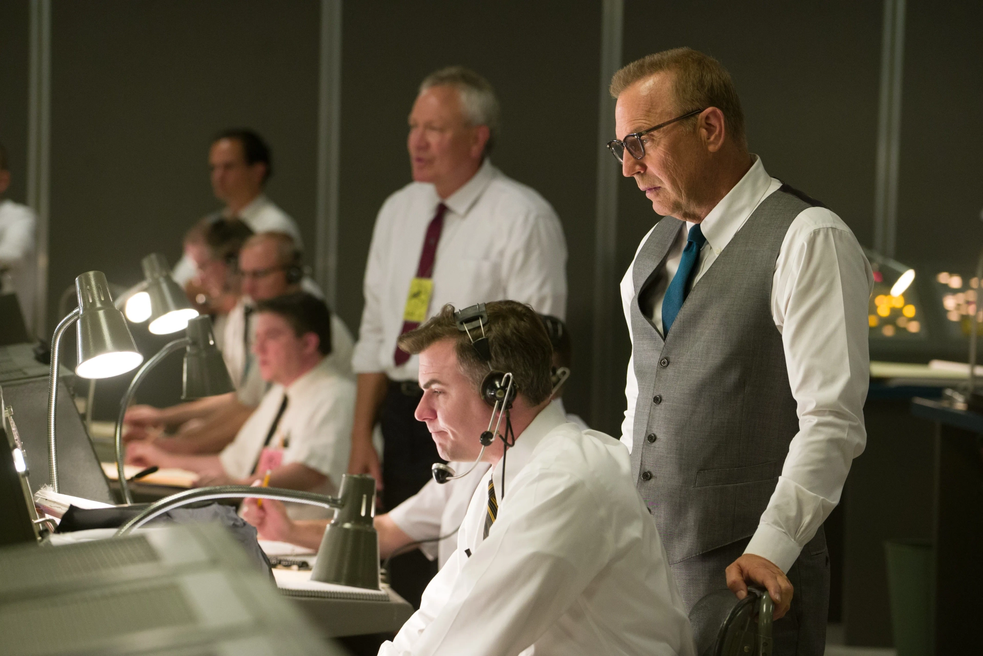 Mission Control Commander (Cullen Moss) and Al Harrison (Kevin Costner) processing some grim news, in Hidden Figures.