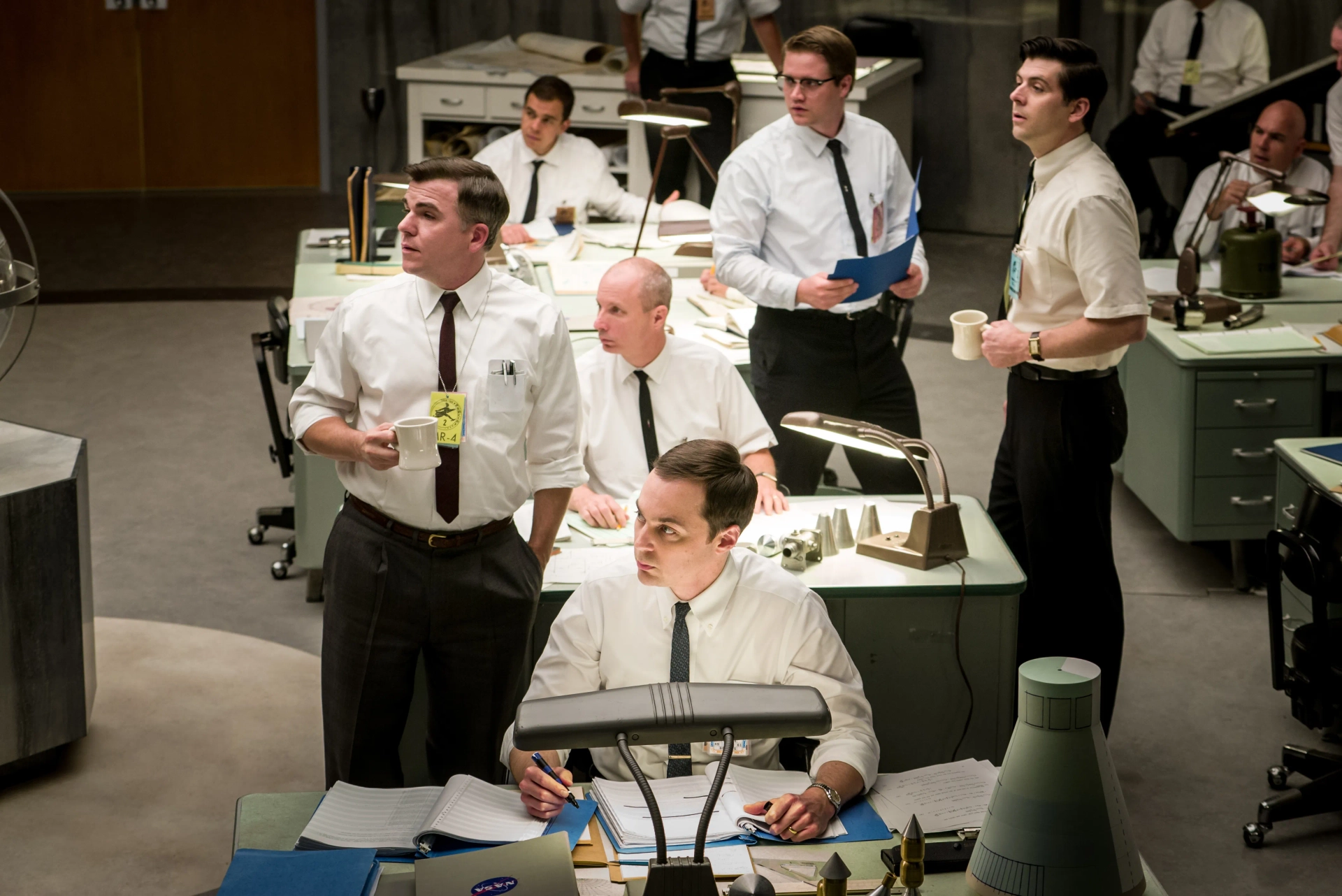 All eyes on Al Harrison, in the Space Task Group room. Hidden Figures. With Jim Parsons and Kenneth Jones.