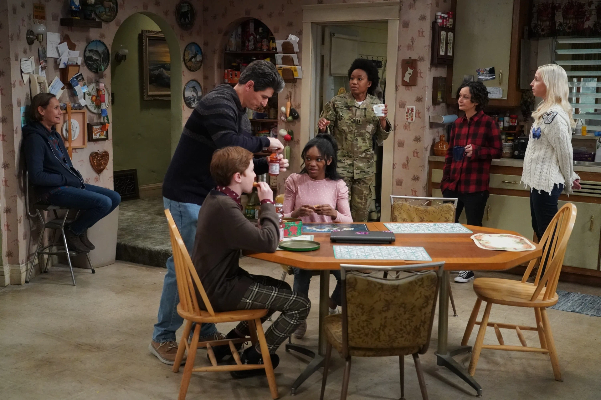 Sara Gilbert, Michael Fishman, Alicia Goranson, Laurie Metcalf, Maya Lynne Robinson, Jayden Rey, and Ames McNamara in The Conners: Two Proposals, a Homecoming and a Bear (2021)