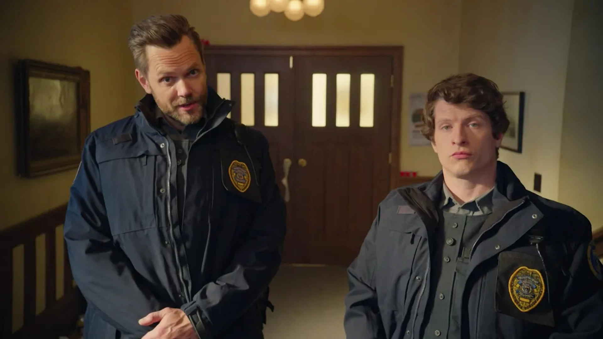 Joel McHale and Michael Rowland in Animal Control (2023)