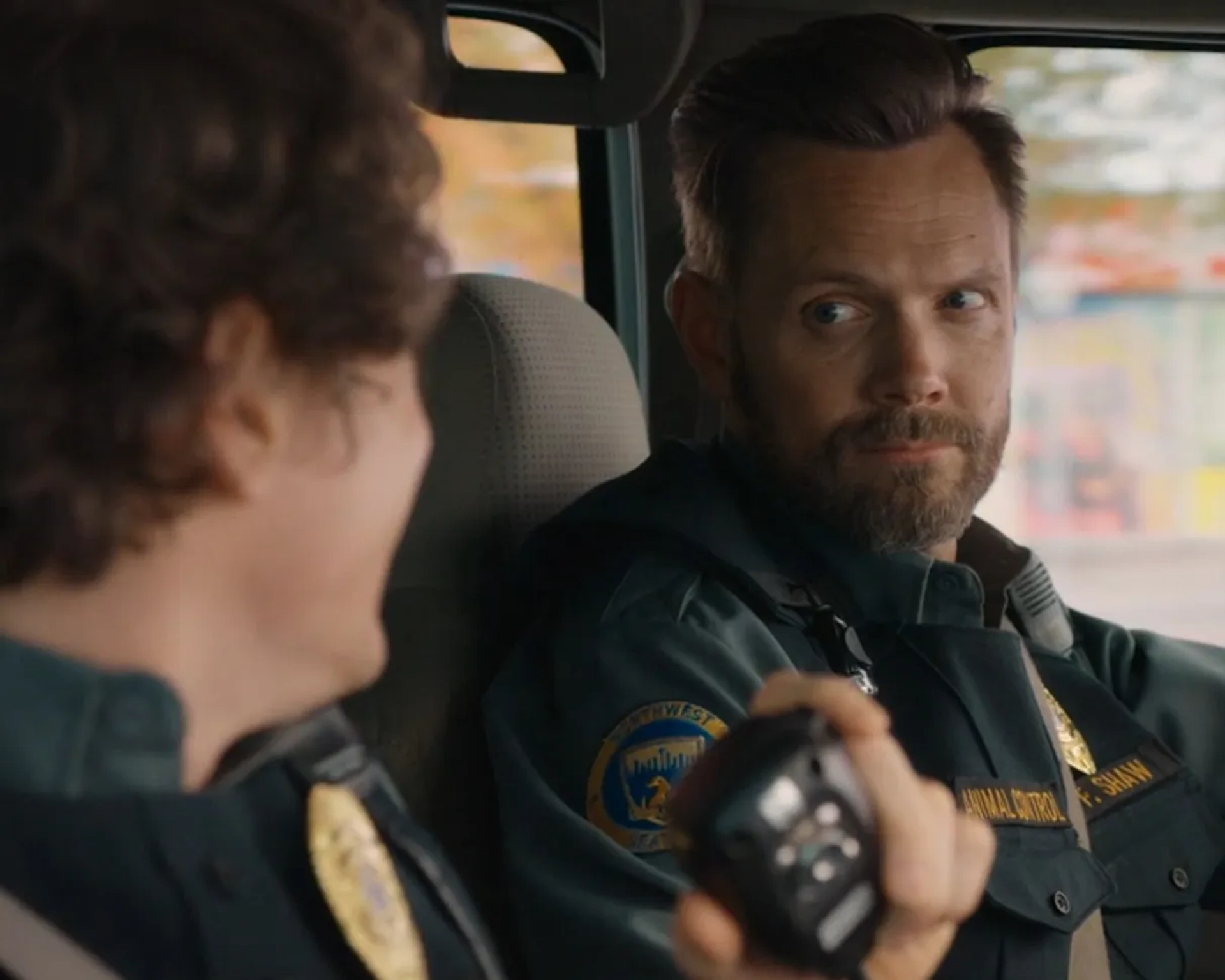 Joel McHale and Michael Rowland in Animal Control (2023)