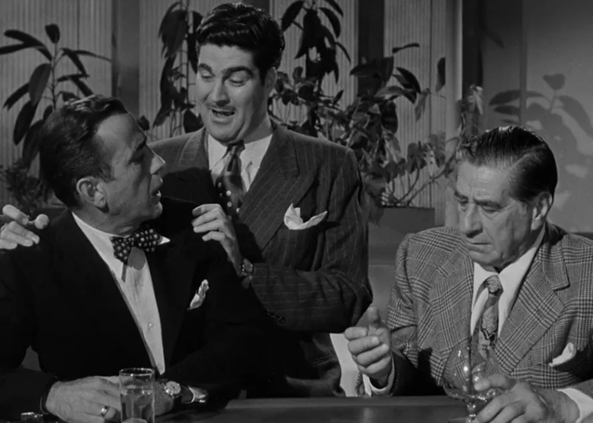 Humphrey Bogart, Lewis Howard, and Robert Warwick in In a Lonely Place (1950)