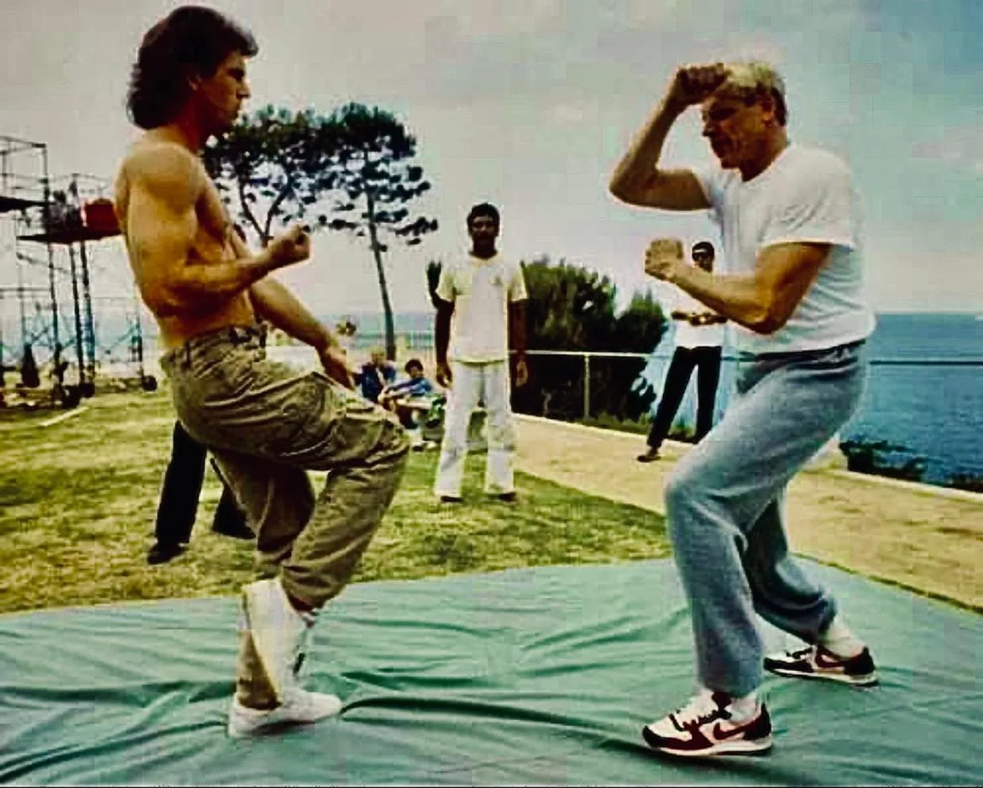 Mel Gibson, Gary Busey, and Rorion Gracie in Lethal Weapon (1987)