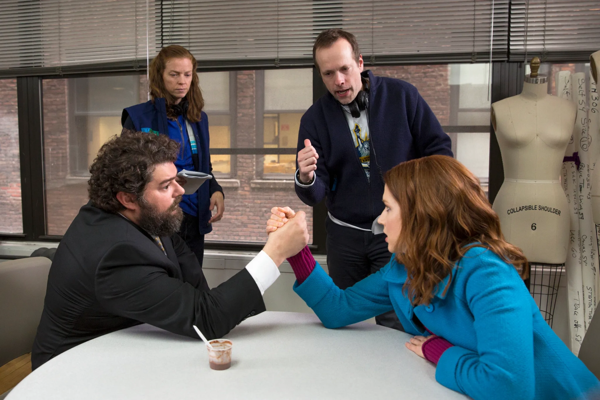 Robert Carlock, Bobby Moynihan, and Ellie Kemper in Unbreakable Kimmy Schmidt (2015)