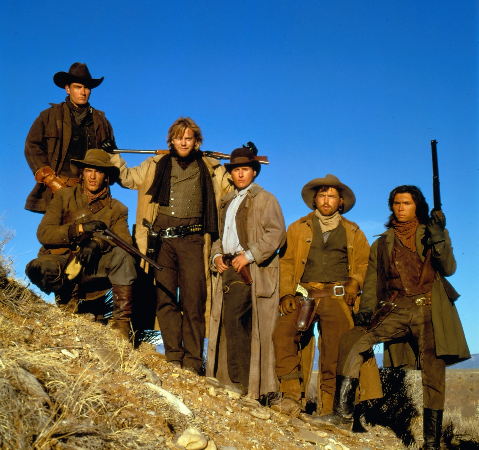 Charlie Sheen, Emilio Estevez, Dermot Mulroney, Kiefer Sutherland, Lou Diamond Phillips, and Casey Siemaszko in Young Guns (1988)