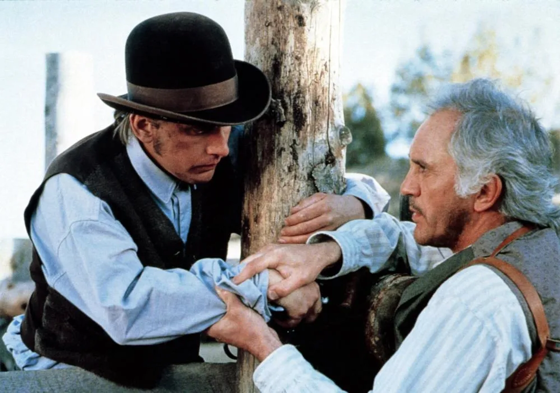 Emilio Estevez and Terence Stamp in Young Guns (1988)