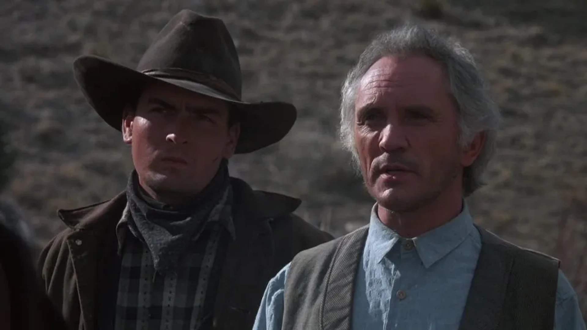 Charlie Sheen and Terence Stamp in Young Guns (1988)