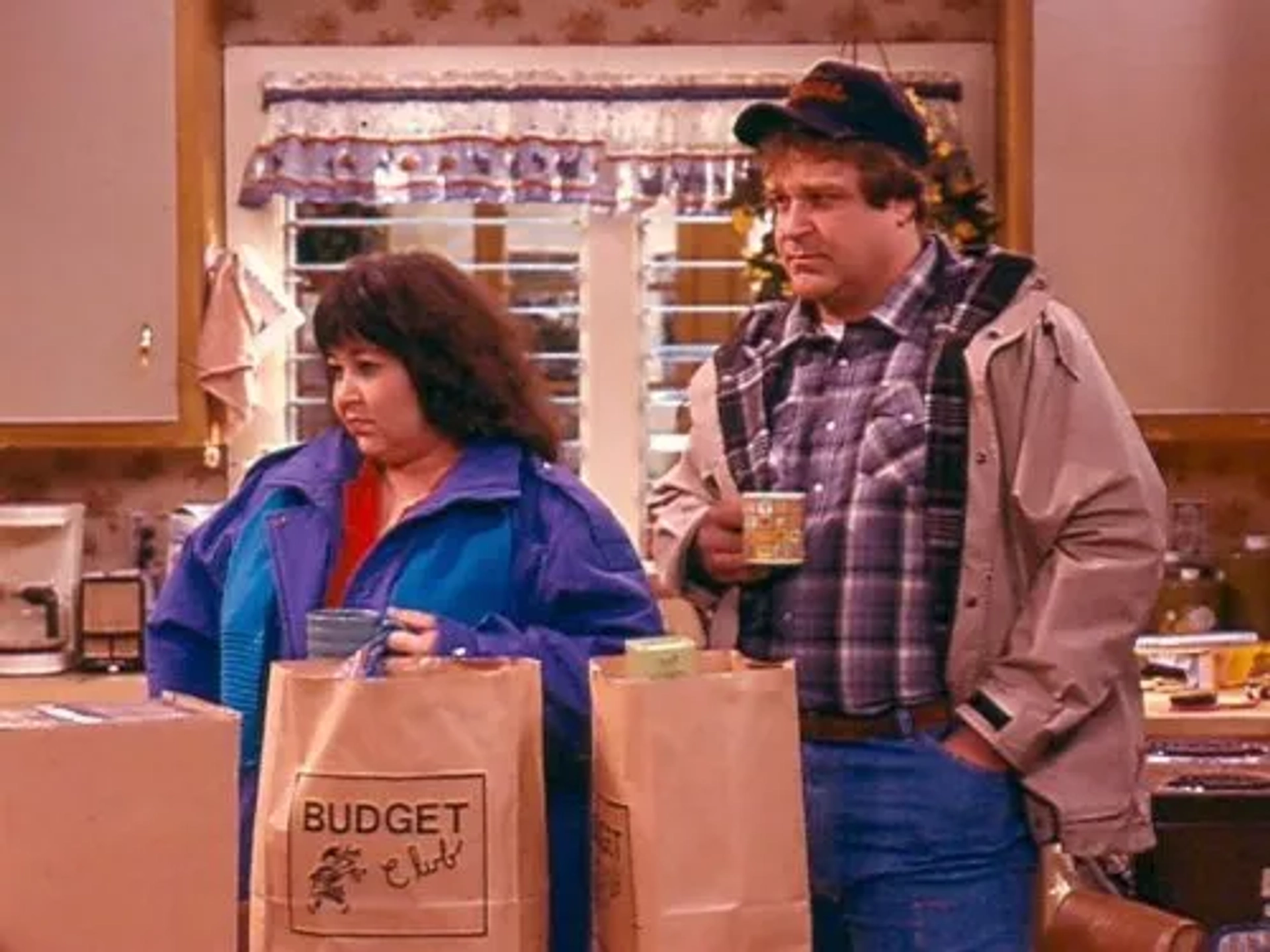 John Goodman and Roseanne Barr in Roseanne (1988)