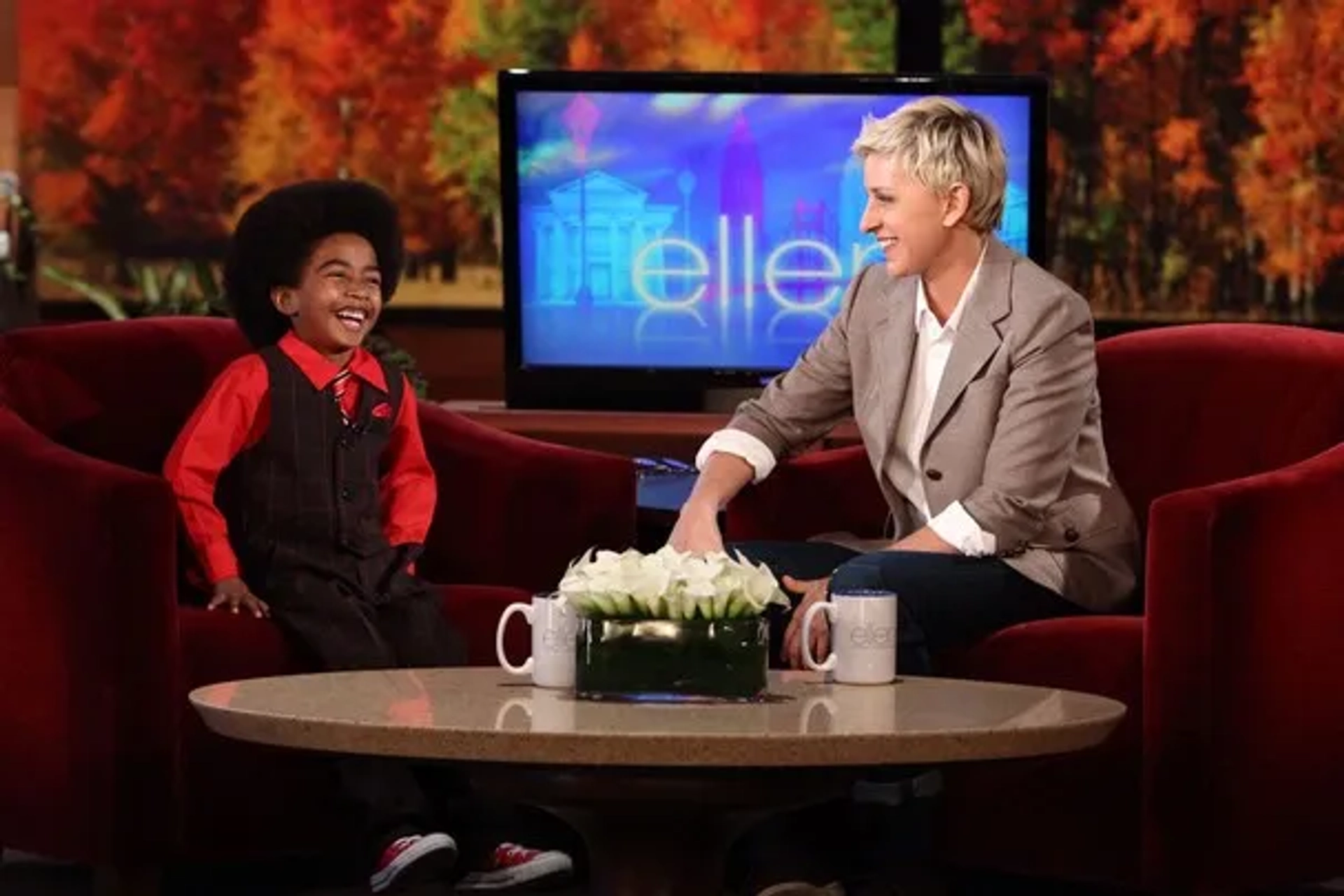 Miles Brown smiles with Ellen DeGeneres as a guest.