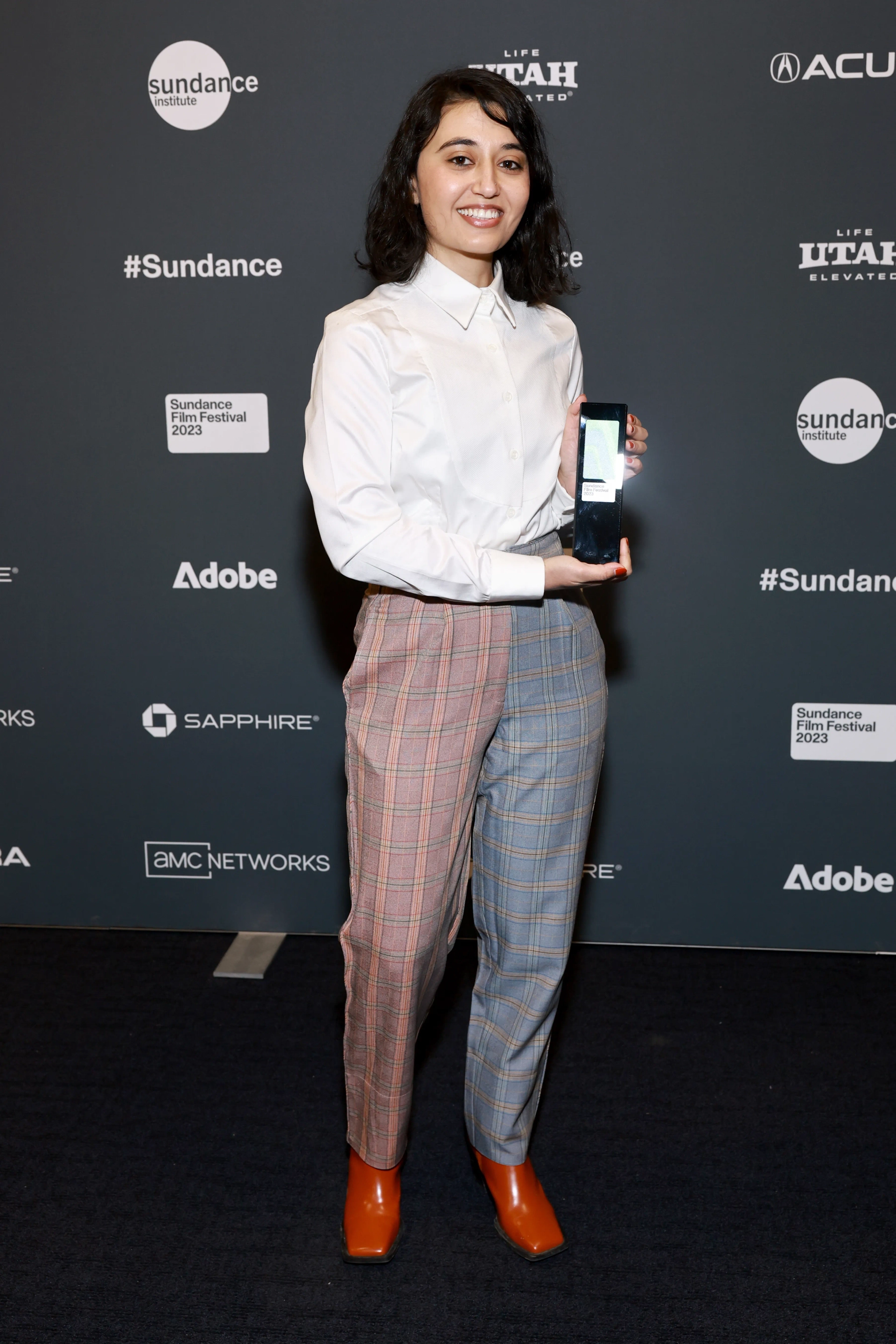 Noora Niasari poses with The Audience Award: World Cinema Dramatic, Presented for ‘SHAYDA’ during the 2023 Sundance Film Festival Awards Ceremony