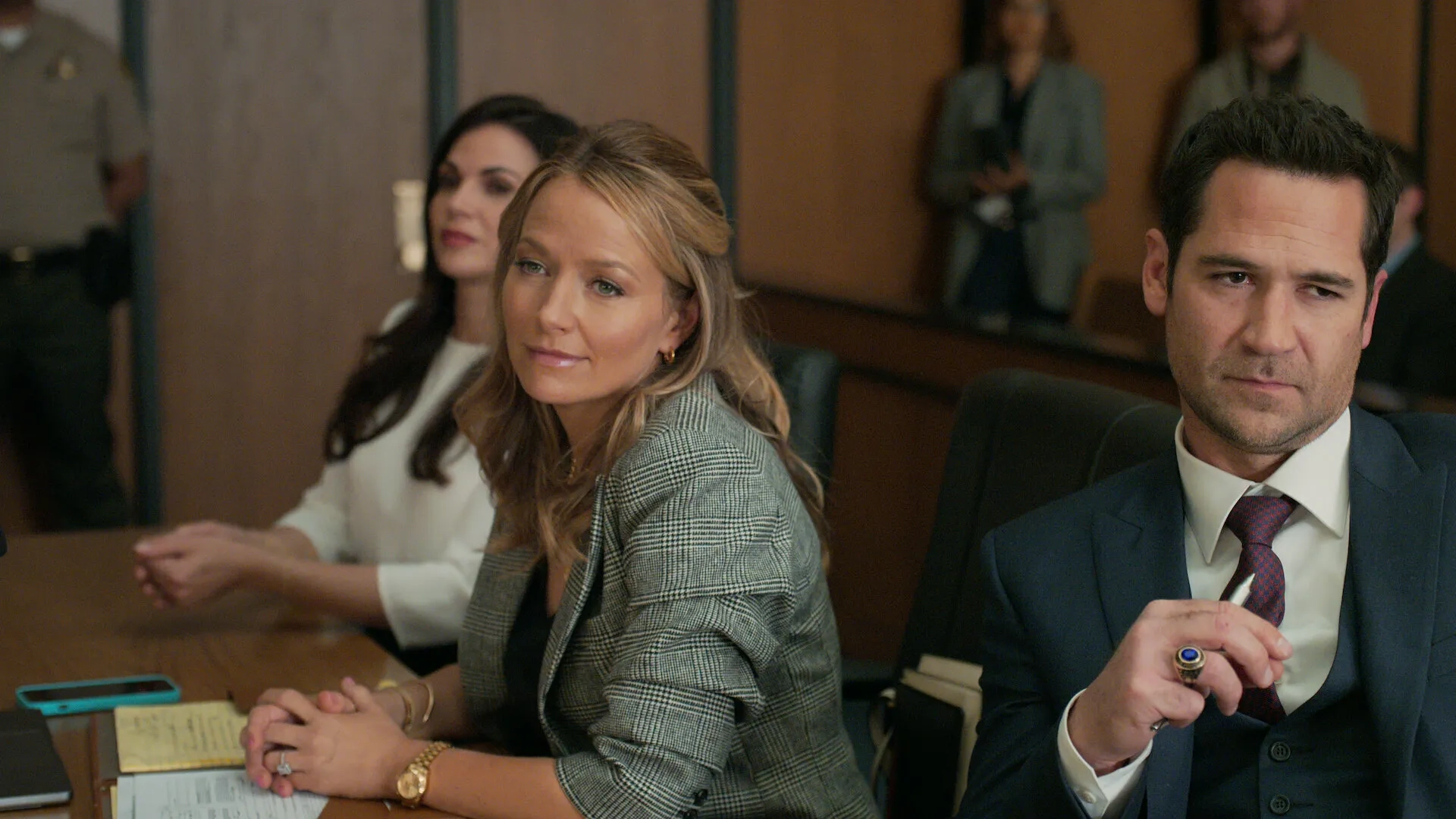 Lana Parrilla, Becki Newton, and Manuel Garcia-Rulfo in The Lincoln Lawyer (2022)