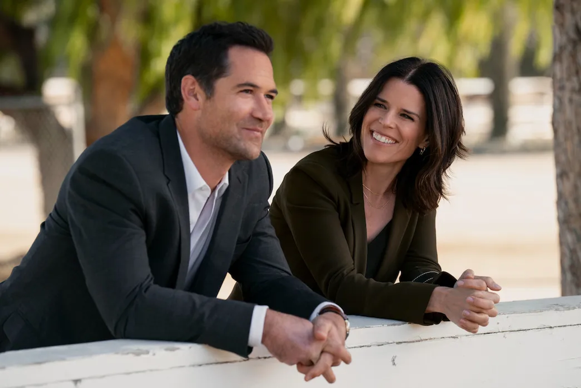 Neve Campbell and Manuel Garcia-Rulfo in The Lincoln Lawyer (2022)