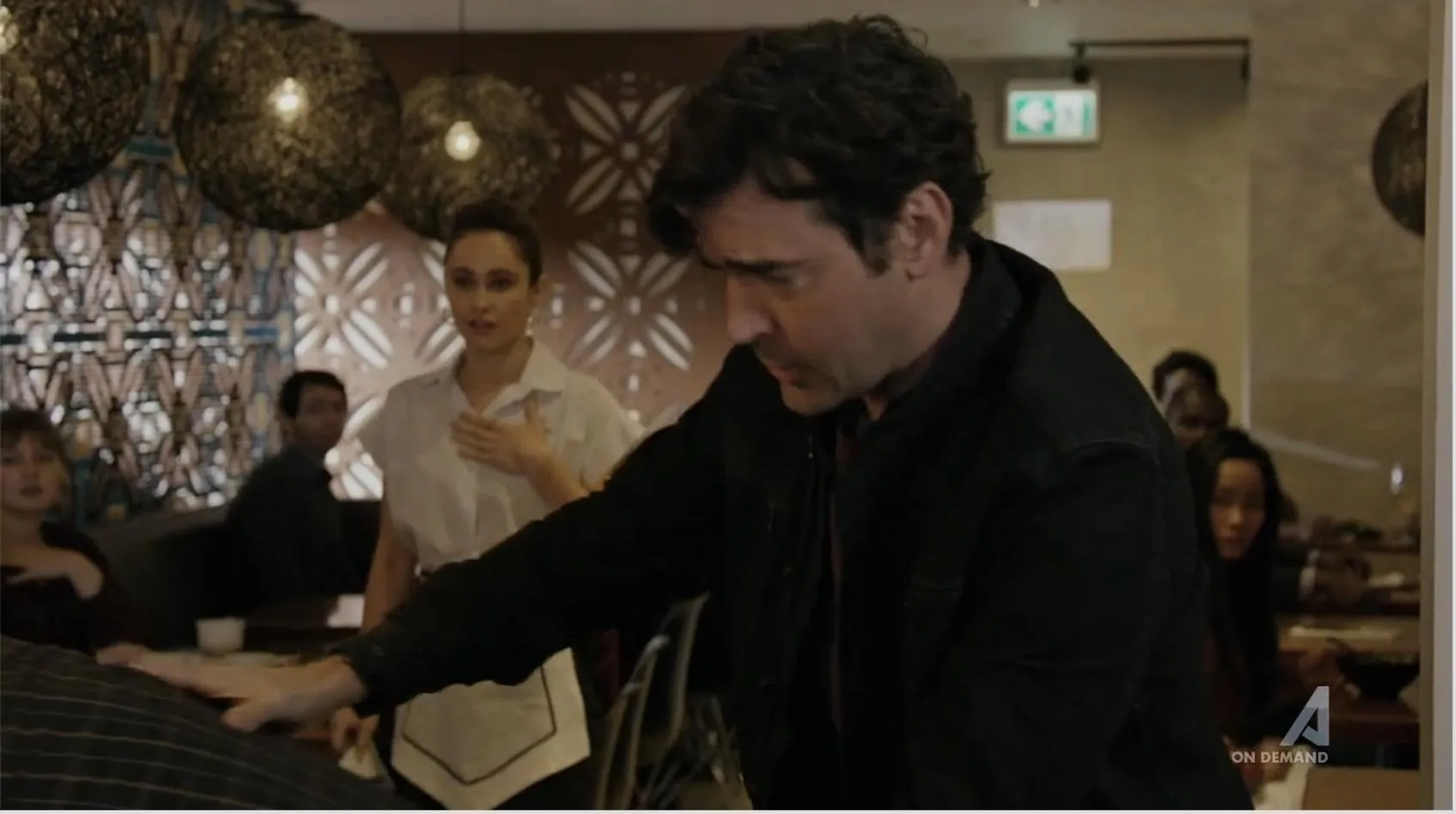 Still shot of Kristy Dawn Dinsmore and Ron Livingston in Loudermilk, "It's all about the beans"