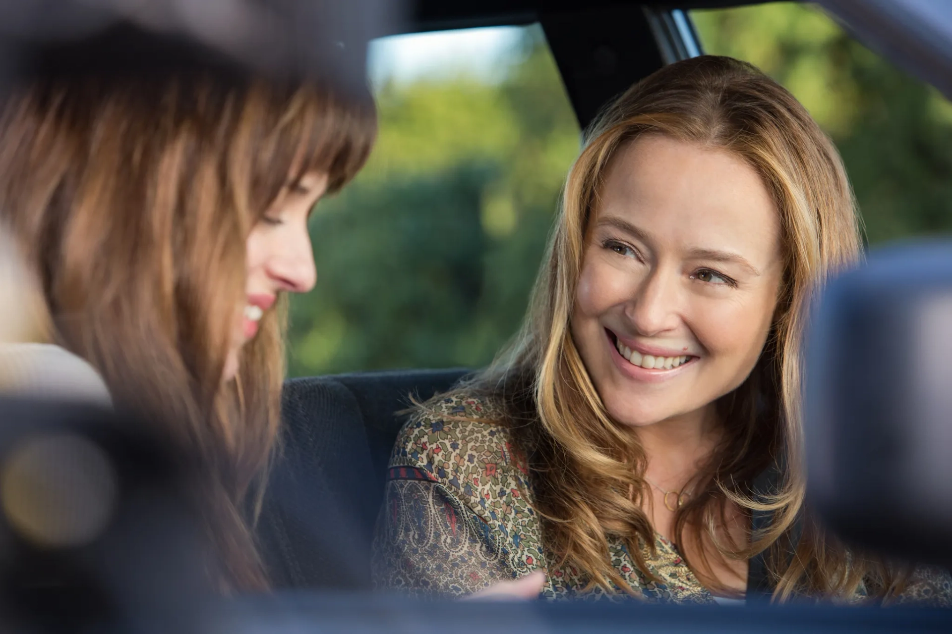 Jennifer Ehle and Dakota Johnson in Fifty Shades of Grey (2015)