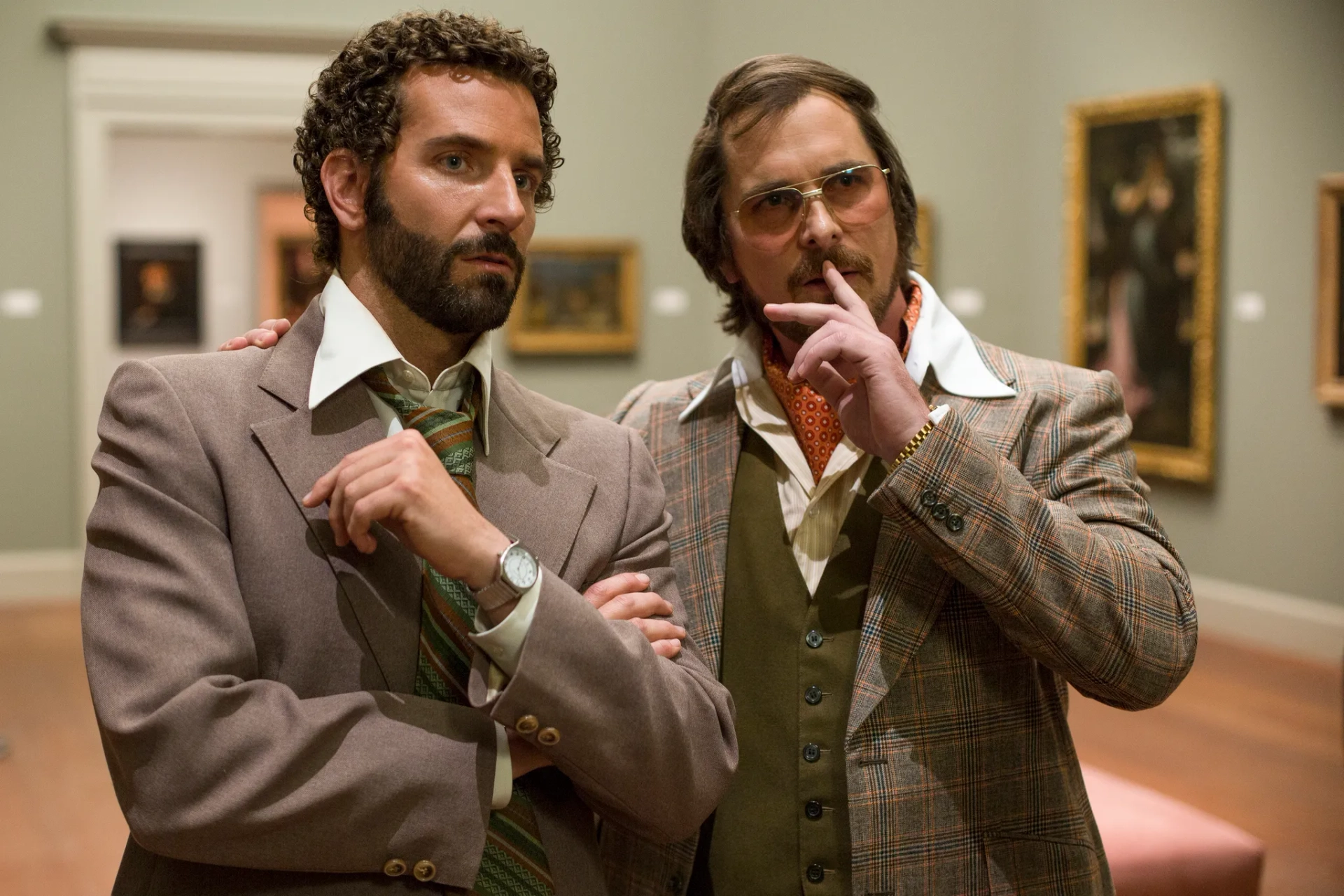 Christian Bale and Bradley Cooper in American Hustle (2013)