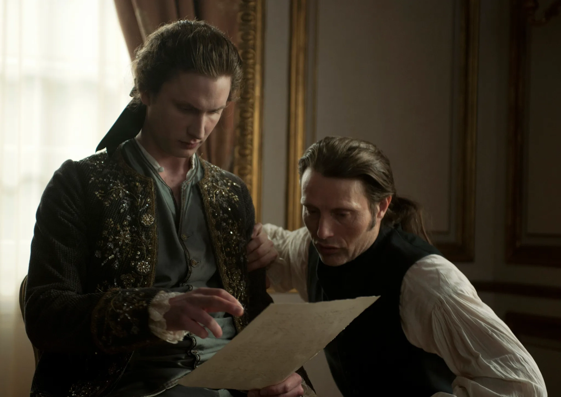 Mads Mikkelsen and Mikkel Boe Følsgaard in A Royal Affair (2012)