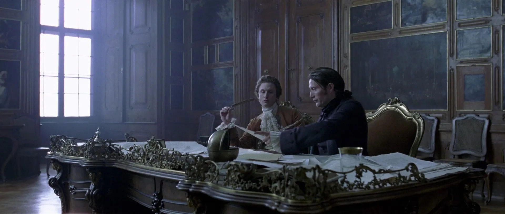 Mads Mikkelsen and Mikkel Boe Følsgaard in A Royal Affair (2012)