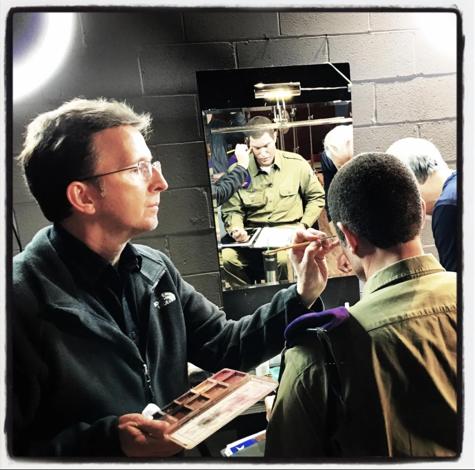 Sacha Baron Cohen gets touched up by Makeup Designer Tony Gardner behind the scenes on Showtime's "Who Is America?"