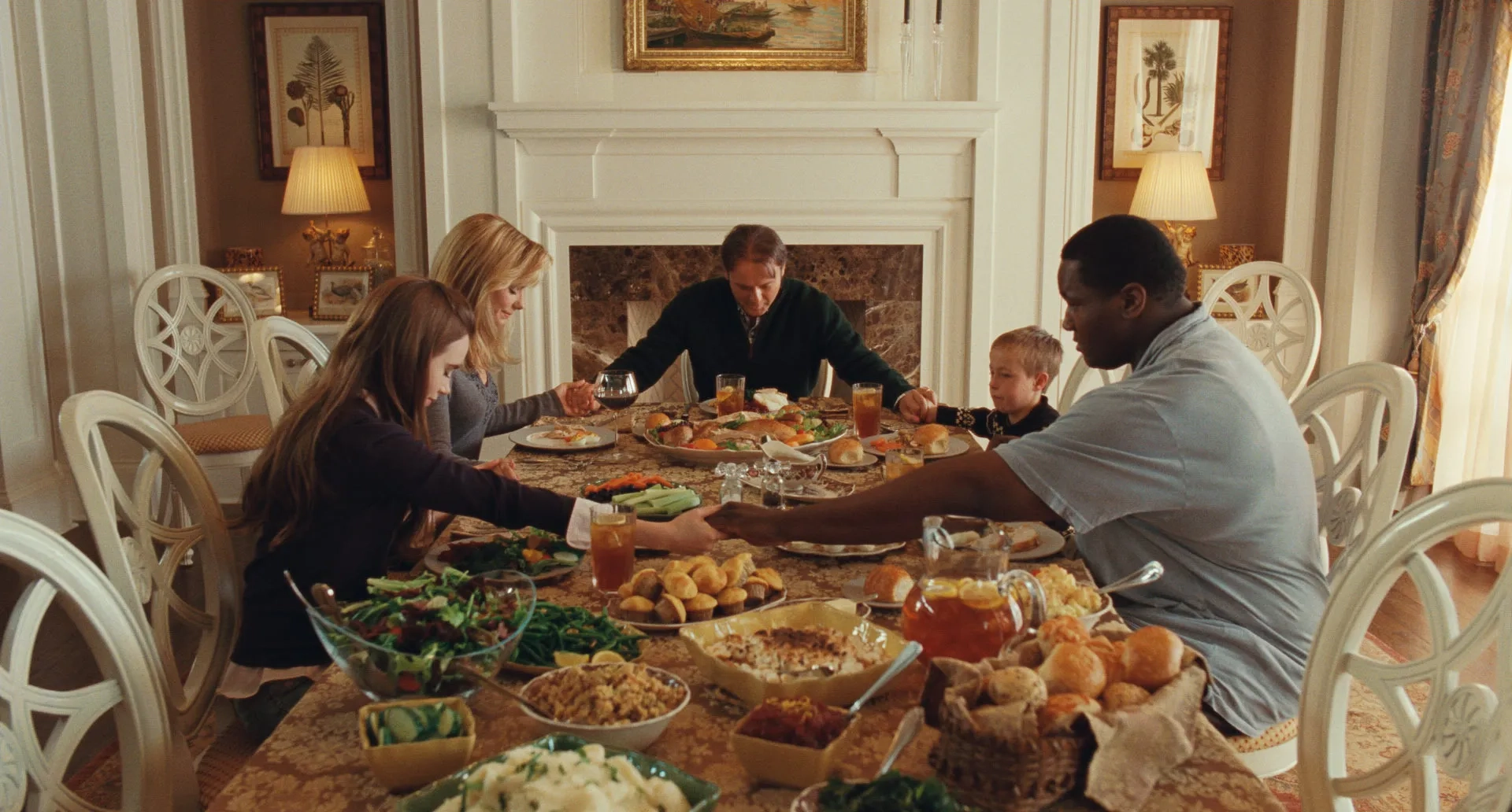 Sandra Bullock, Tim McGraw, Jae Head, Quinton Aaron, and Lily Collins in The Blind Side (2009)