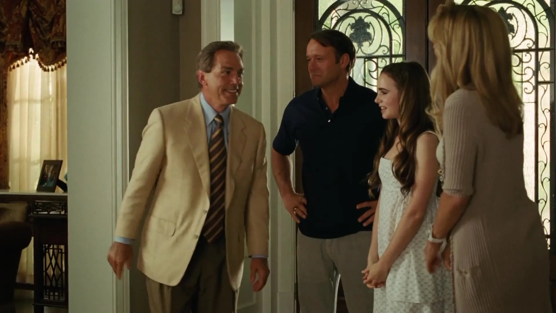 Sandra Bullock, Tim McGraw, Nick Saban, and Lily Collins in The Blind Side (2009)