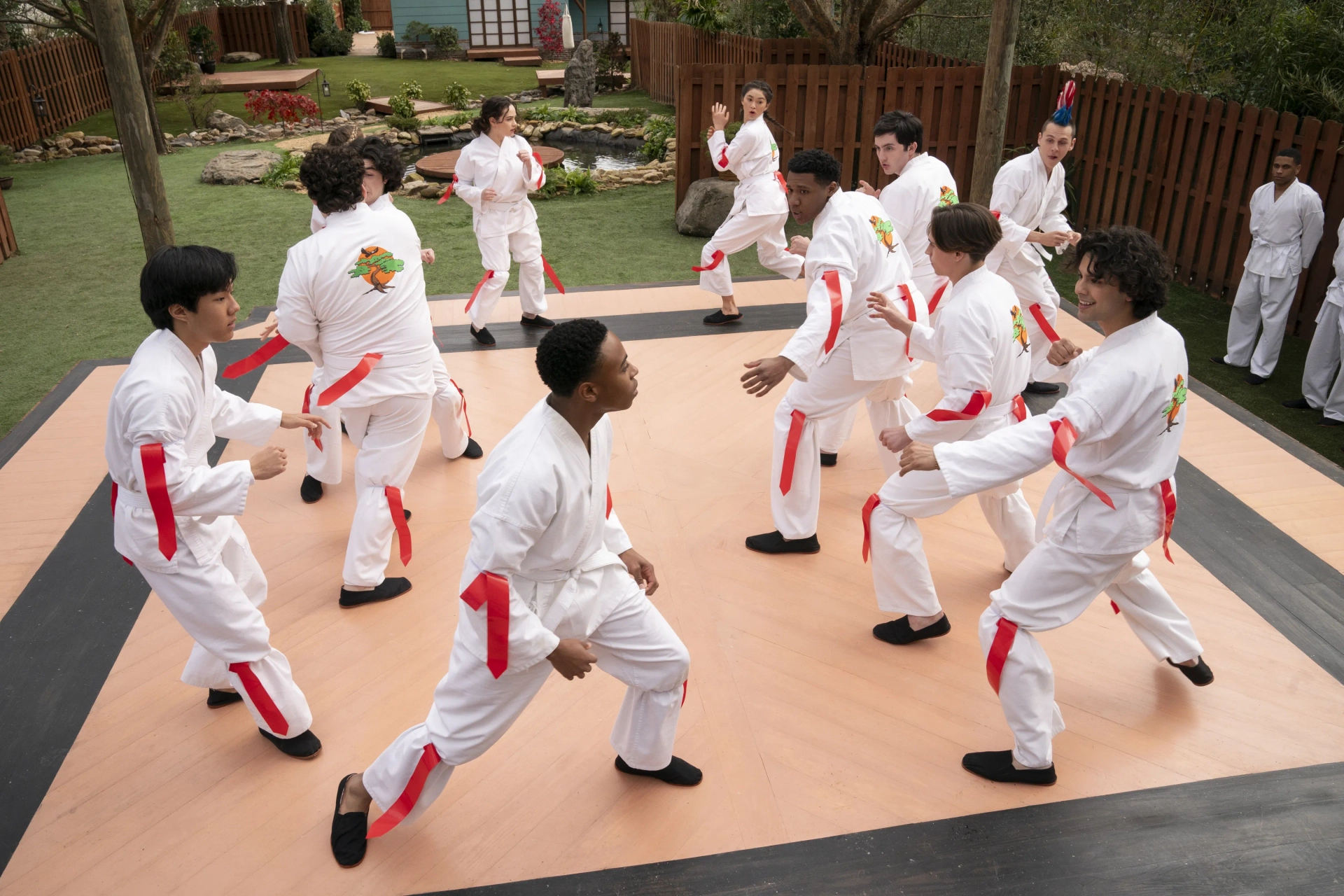 Nathaniel Oh, Oona O'Brien, Mary Mouser, Jacob Bertrand, Tanner Buchanan, Gianni DeCenzo, Xolo Maridueña, Dallas Dupree Young, and Khalil Everage in Cobra Kai (2018)