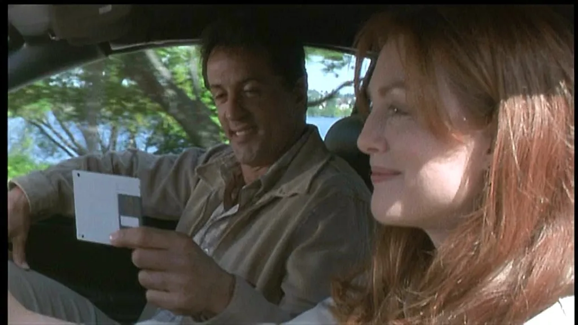 Julianne Moore and Sylvester Stallone in Assassins (1995)