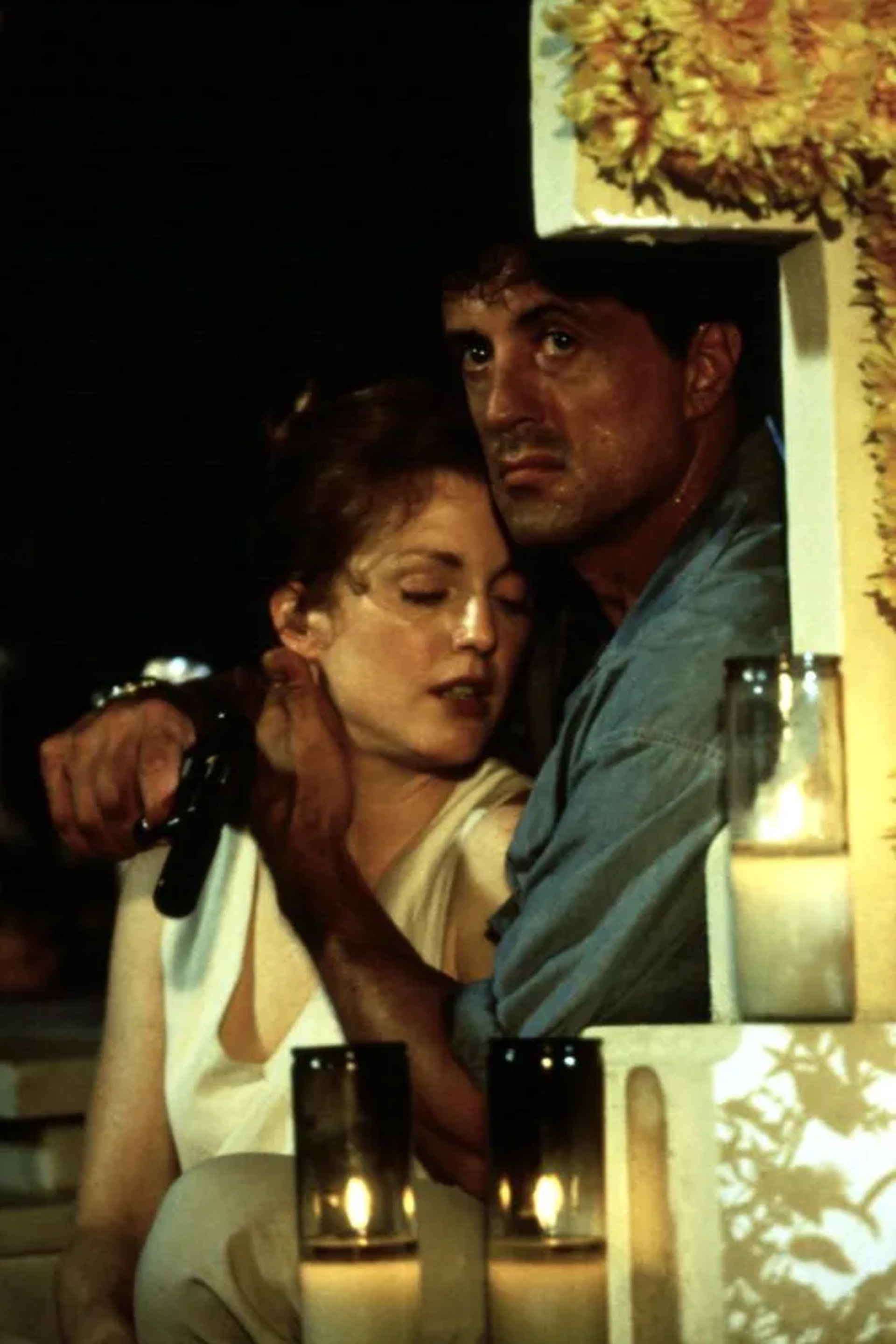 Julianne Moore and Sylvester Stallone in Assassins (1995)