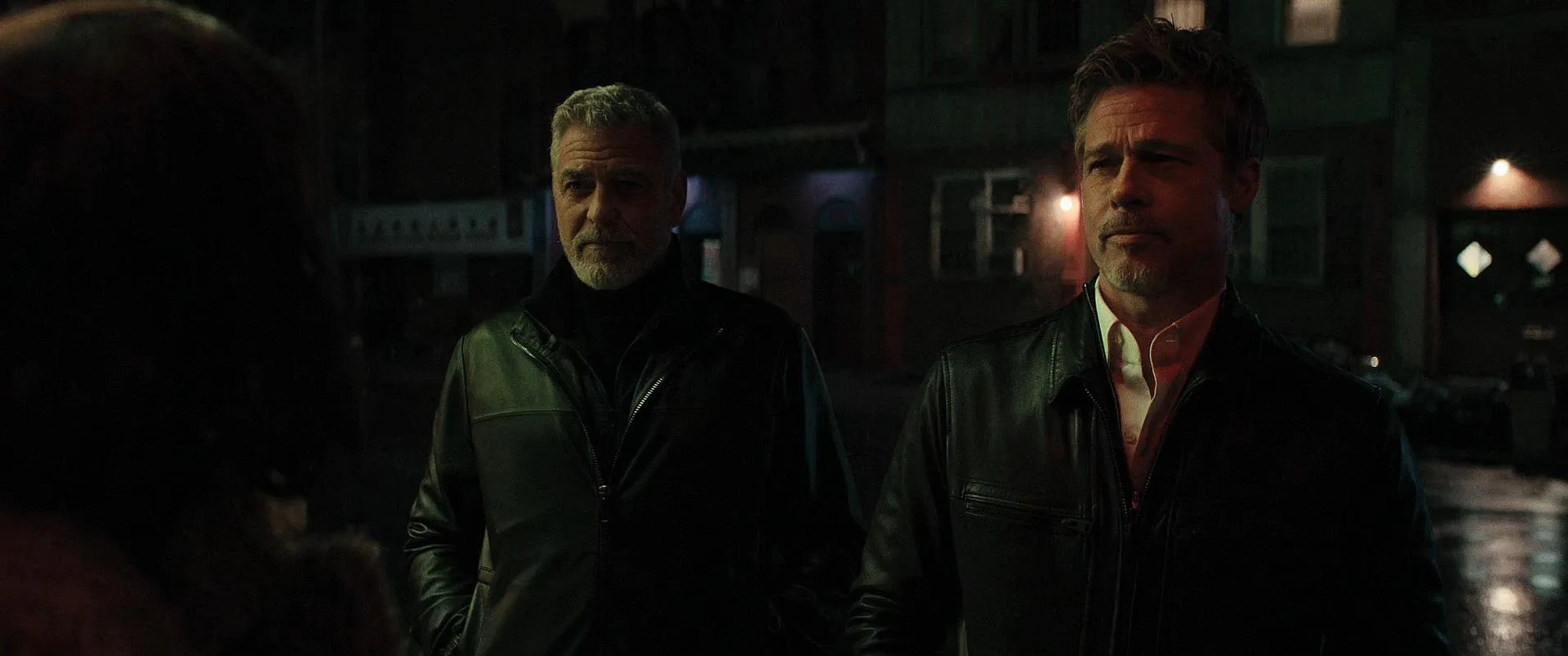 Brad Pitt, George Clooney, and Poorna Jagannathan in Wolfs (2024)