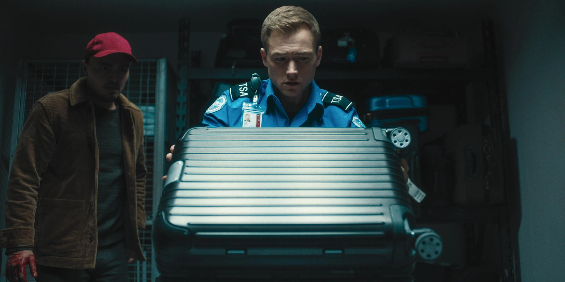 Taron Egerton and Tonatiuh in Carry-On (2024)