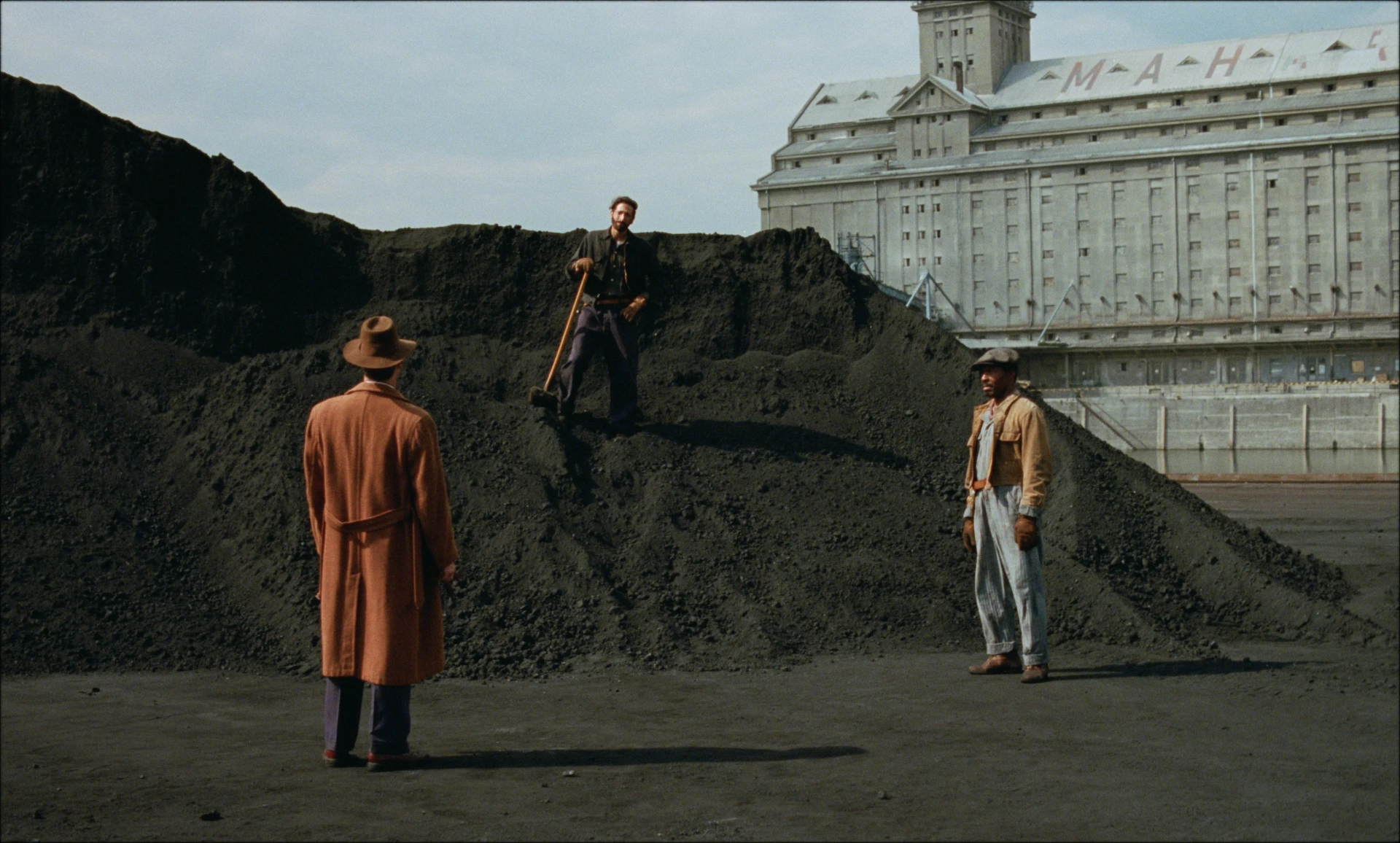 Guy Pearce, Adrien Brody, and Isaach De Bankolé in The Brutalist (2024)