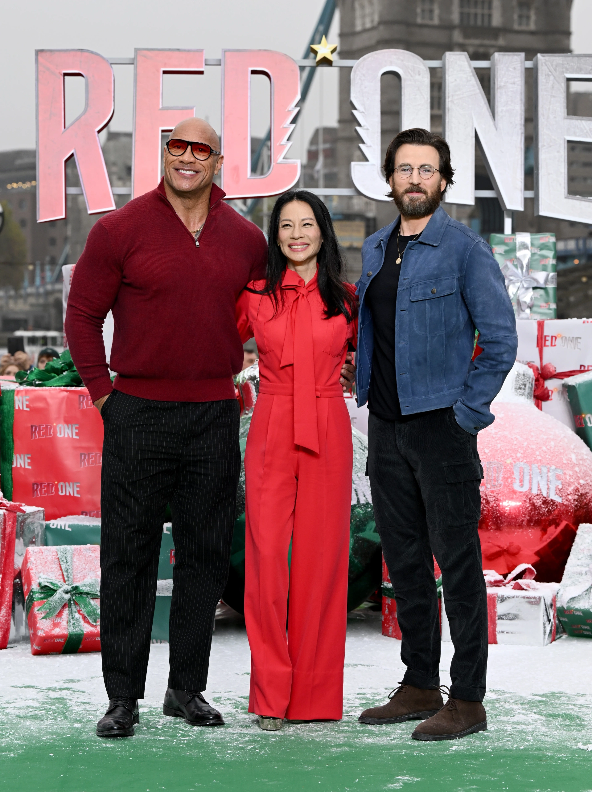 Lucy Liu, Chris Evans, and Dwayne Johnson at an event for Red One (2024)