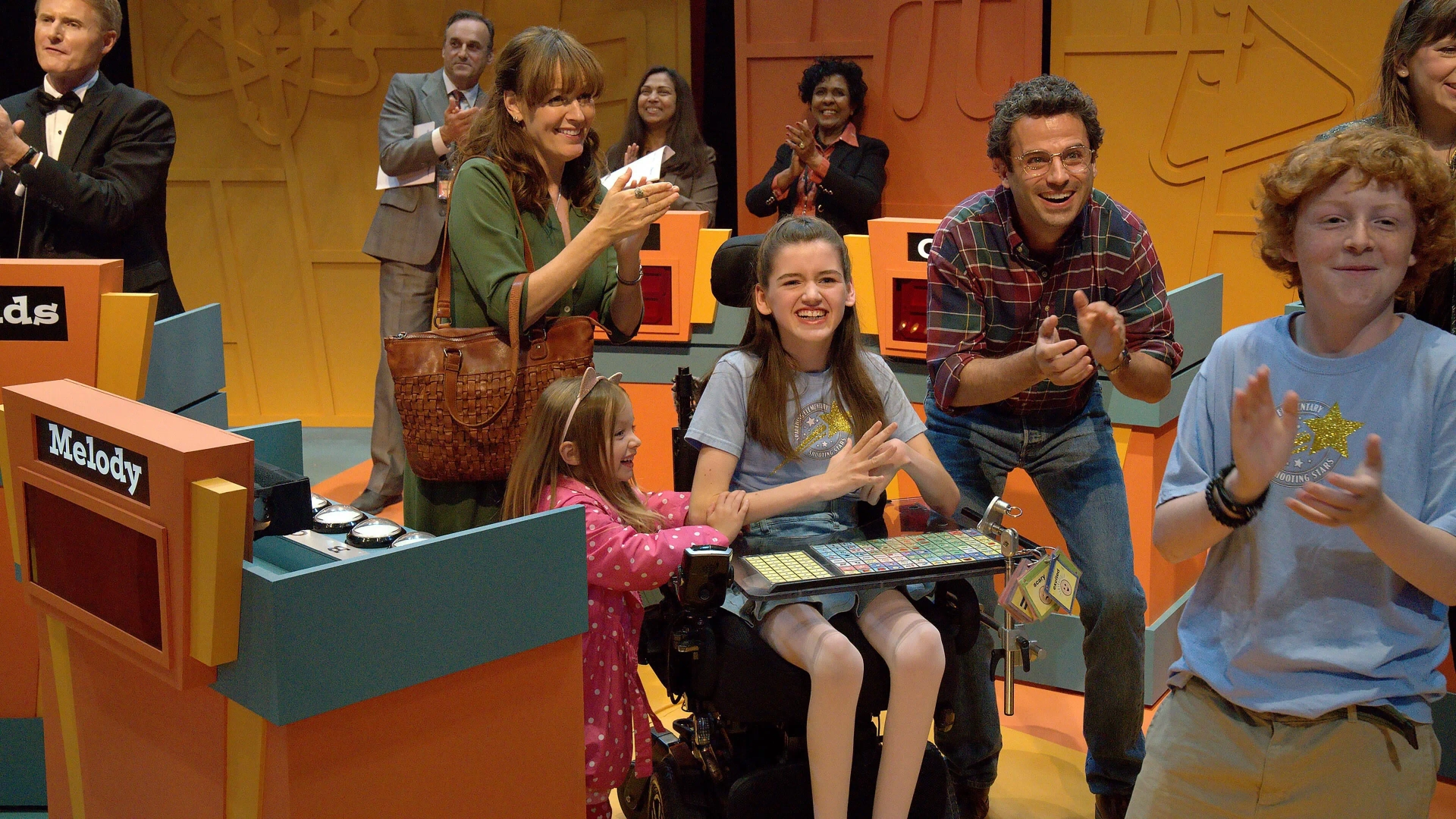 Luke Kirby, Phoebe-Rae Taylor, and Rosemarie DeWitt in Out of My Mind (2024)