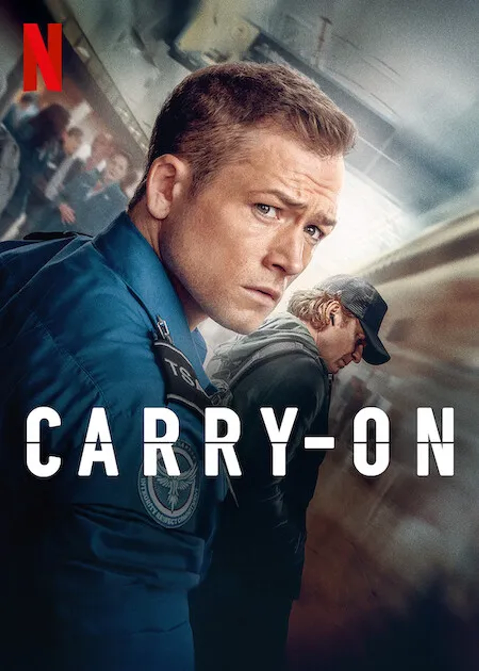 Jason Bateman and Taron Egerton in Carry-On (2024)