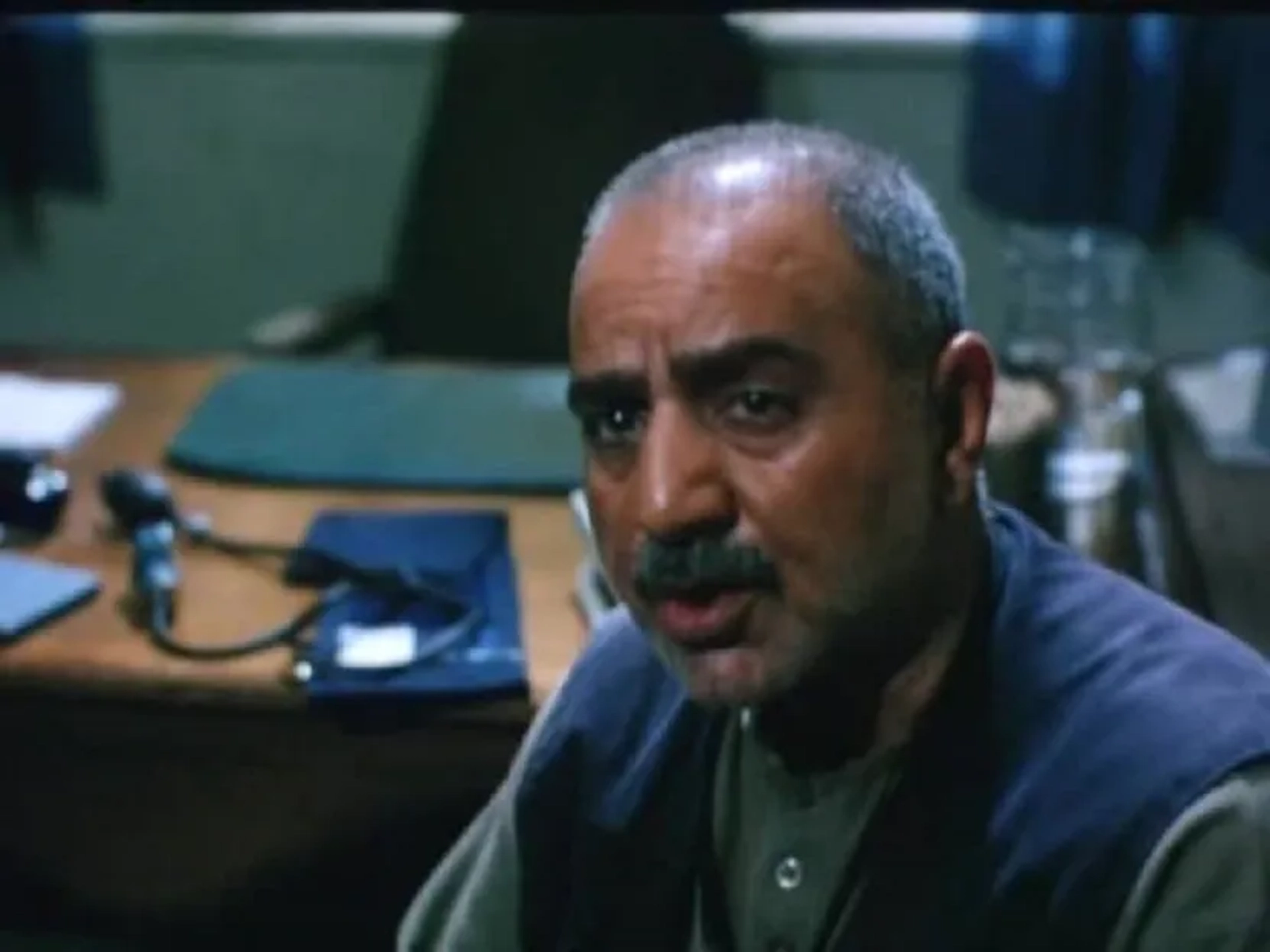 Parviz Parastui in In the Name of the Father (2006)