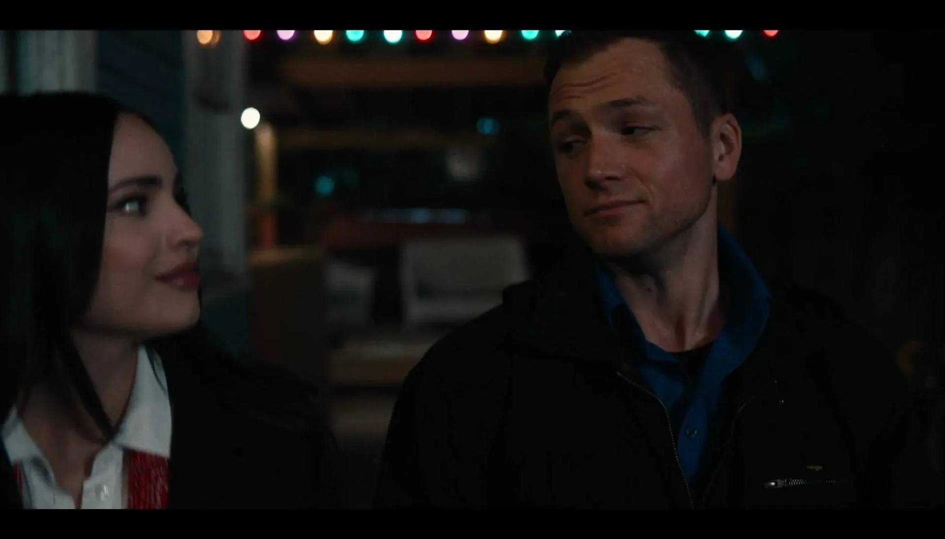 Taron Egerton and Sofia Carson in Carry-On (2024)