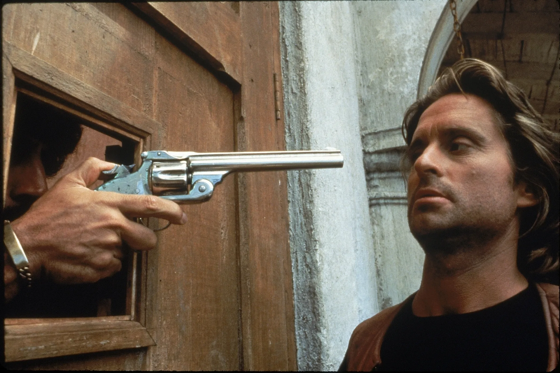 Michael Douglas, Alfonso Arau, and Manuel Ojeda in Romancing the Stone (1984)