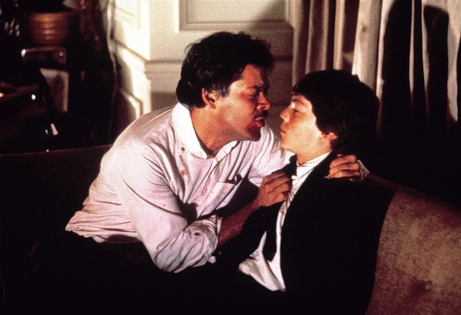 Raul Julia and Griffin O'Neal in The Escape Artist (1982)