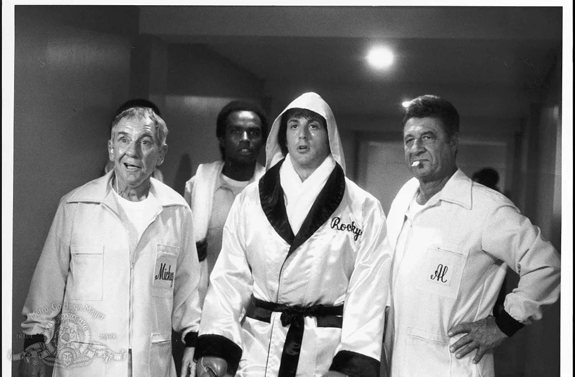 Sylvester Stallone, Shaka Cumbuka, Burgess Meredith, and Al Silvani in Rocky II (1979)